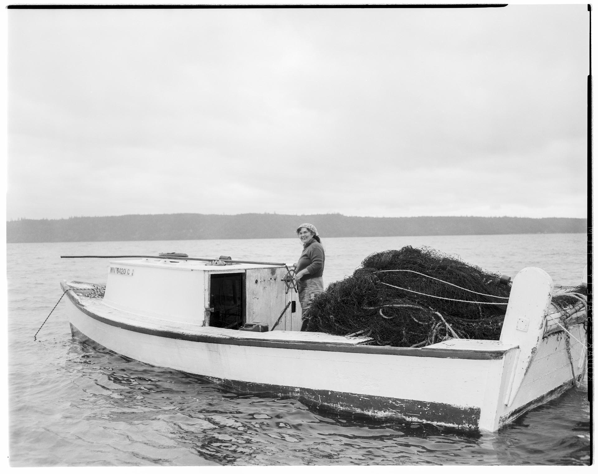 Image of Marya Moses in her fishing boat, July 5, 1962