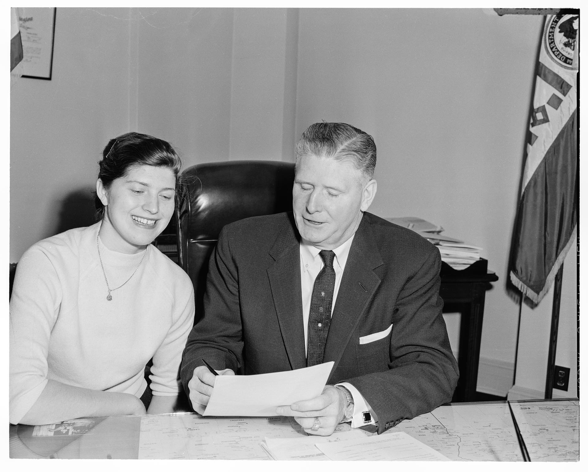 Image of Suzie Ordogh and John Boyd with her permanent residency papers, Seattle, December 24, 1958
