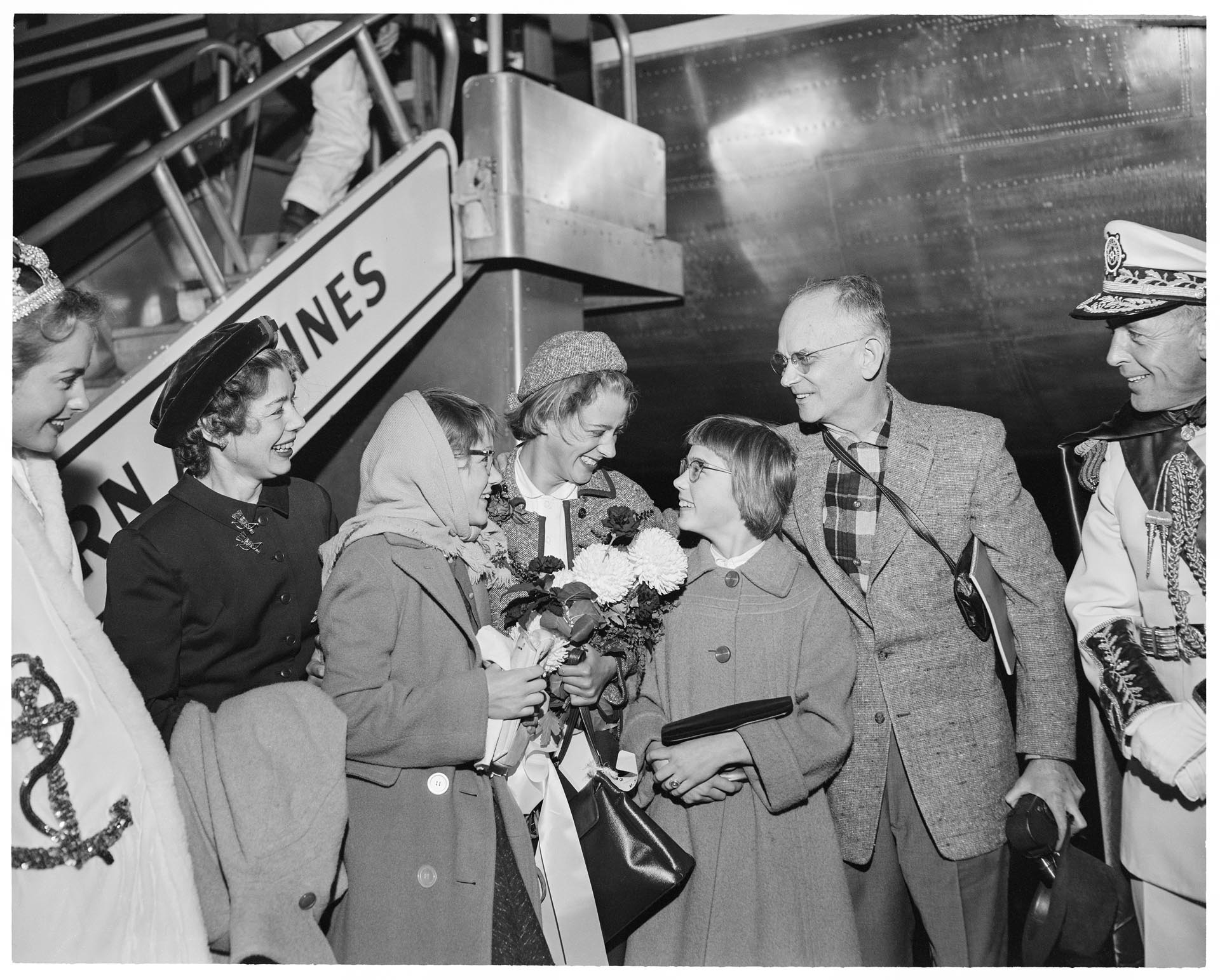 Image of Nancy Ramey with family on her return from the Olympics, Seattle, December 14, 1956