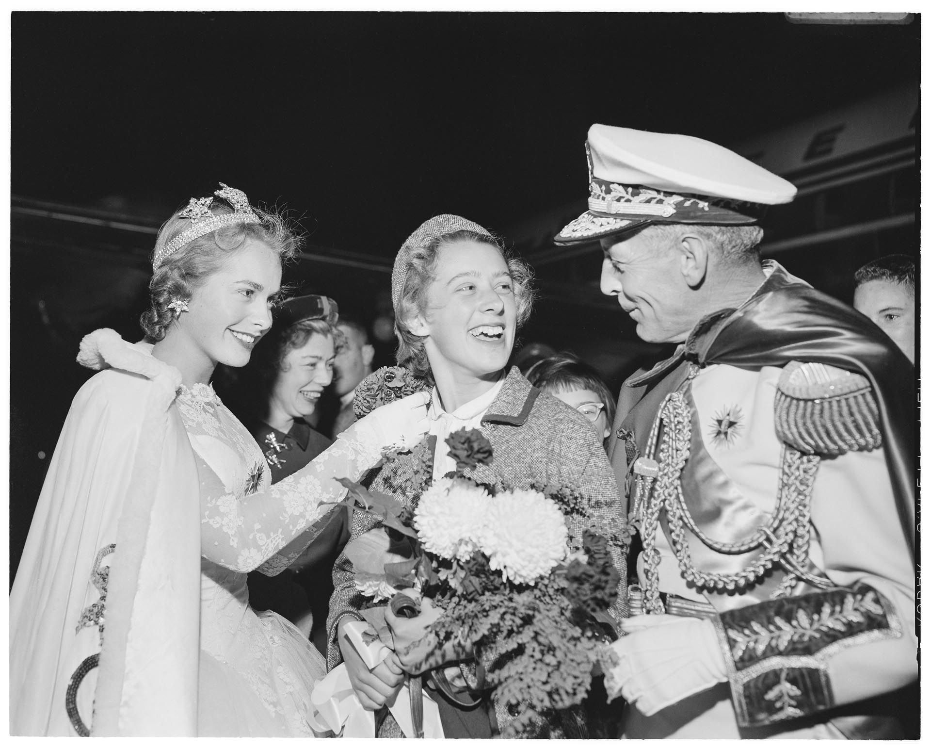 Image of Nancy Ramey with Seafair King and Queen on her return from the Olympics, Seattle, December 14, 1956
