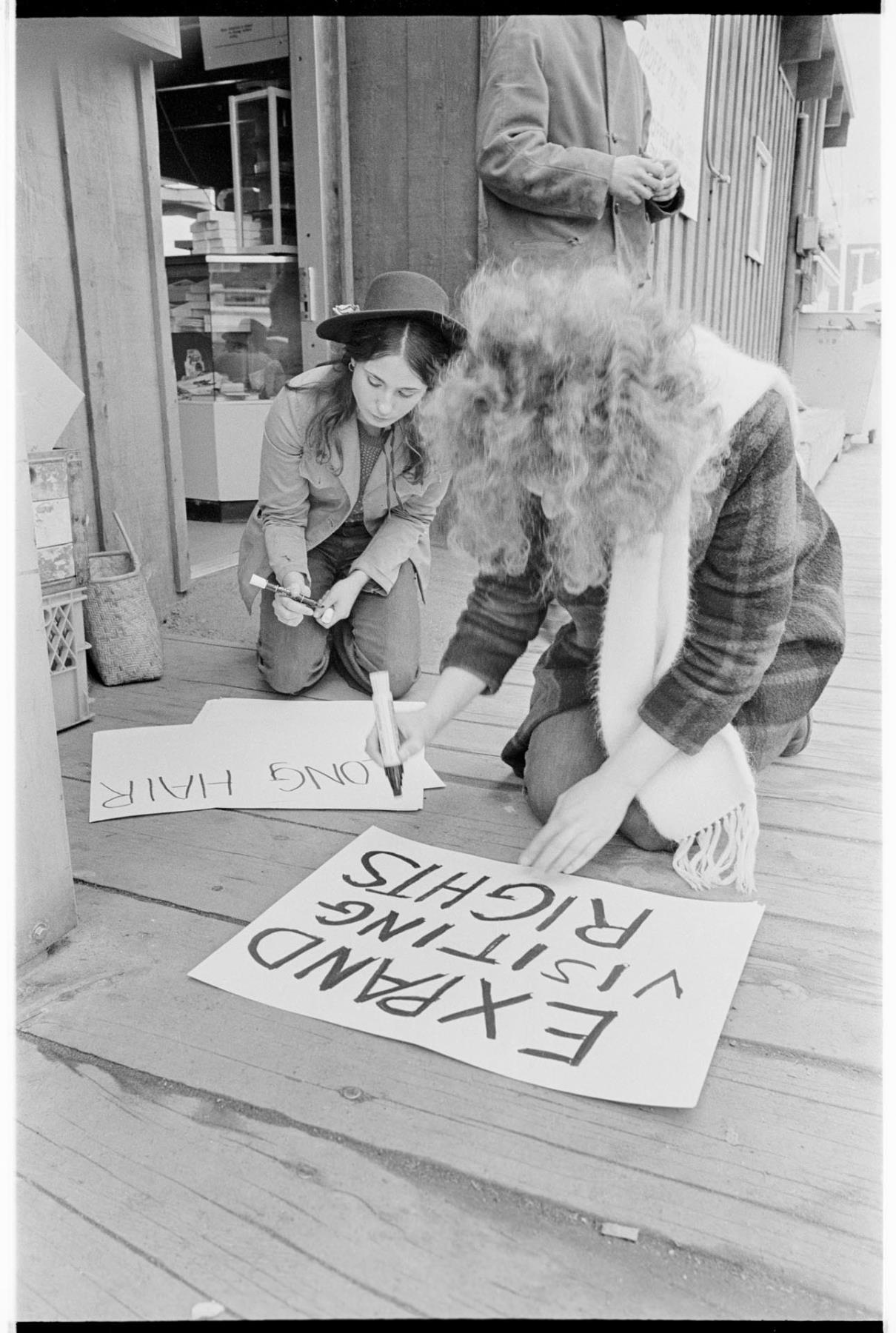 Image of Demonstrators making protest signs at McNeil Island ferry landing, February 1971