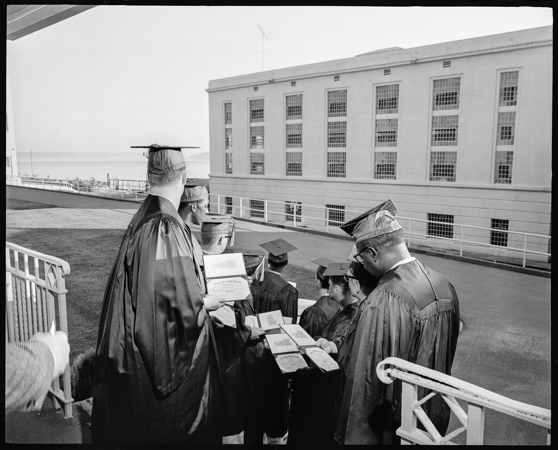 Image of Nine inmates at graduation ceremony at McNeil Island Penitentiary, June 1967