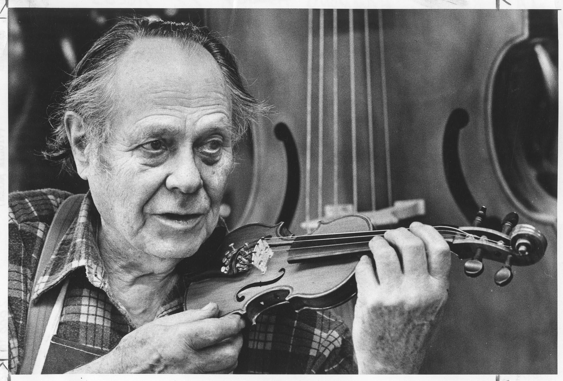 Image of Hammond Ashley holding a treble violin, Seattle, April 26, 1979