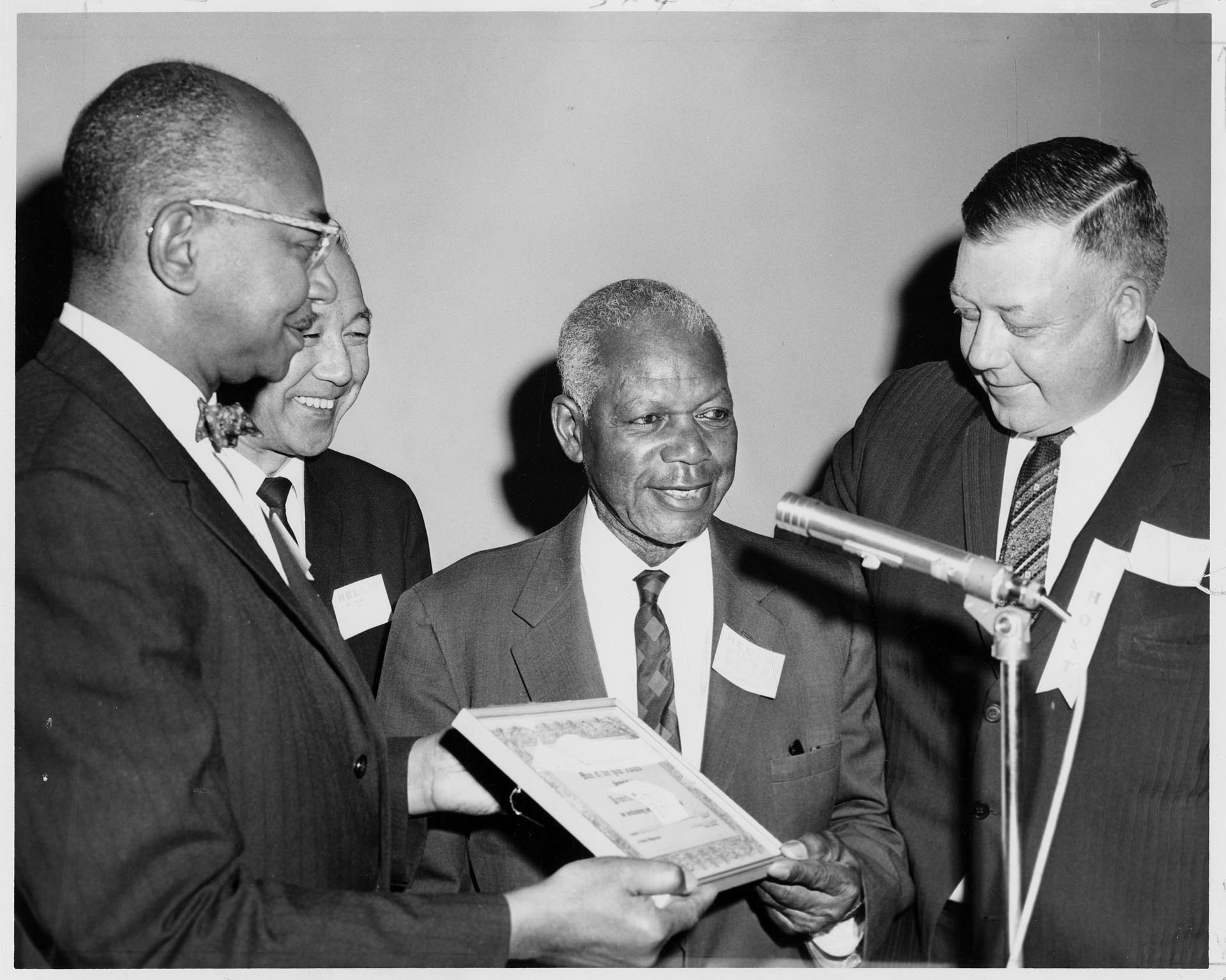 Image of Powell Barnett accepting Jackson Street Community Council Man of the Year award, Seattle, April 1964