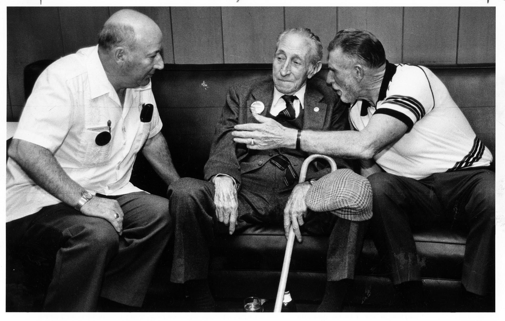 Image of Martin Jugum, Harry Bridges, and William Forester talking at union party, Seattle, June 12, 1986