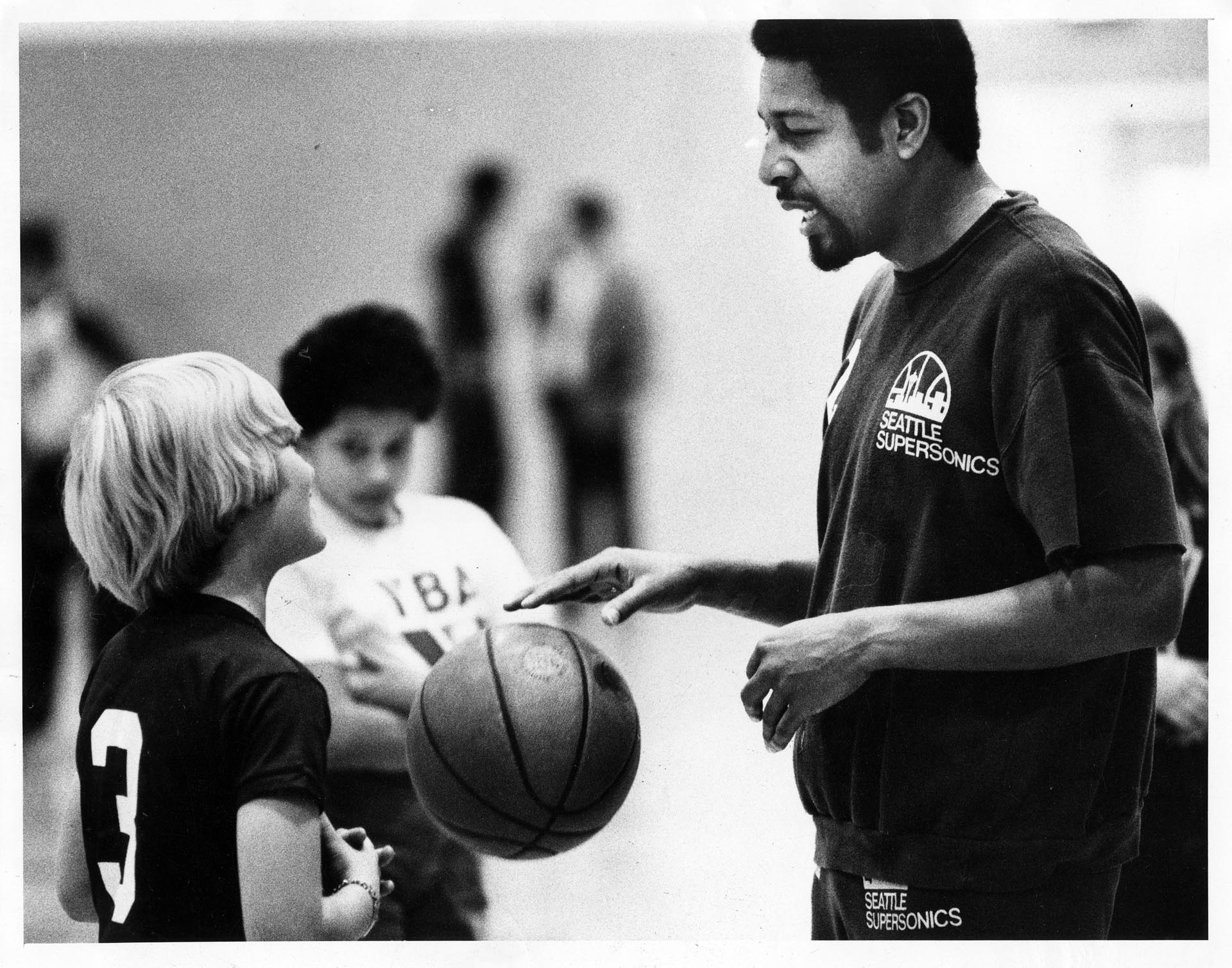 Image of Fred Brown coaching boys at Kingdome, Seattle, November 1980