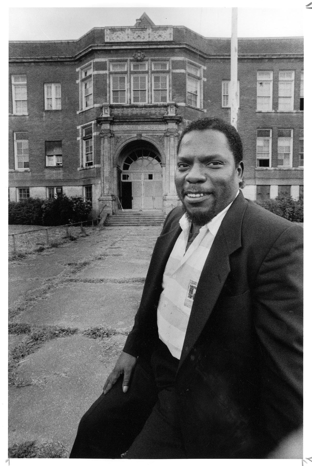 Image of Earl Debnam in front of Colman School, Seattle, July 1990