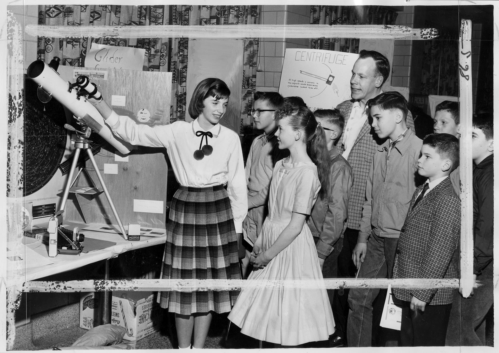 Image of Peggy Dibble showing her exhibit at King County Science Fair, Seattle, March 18, 1961