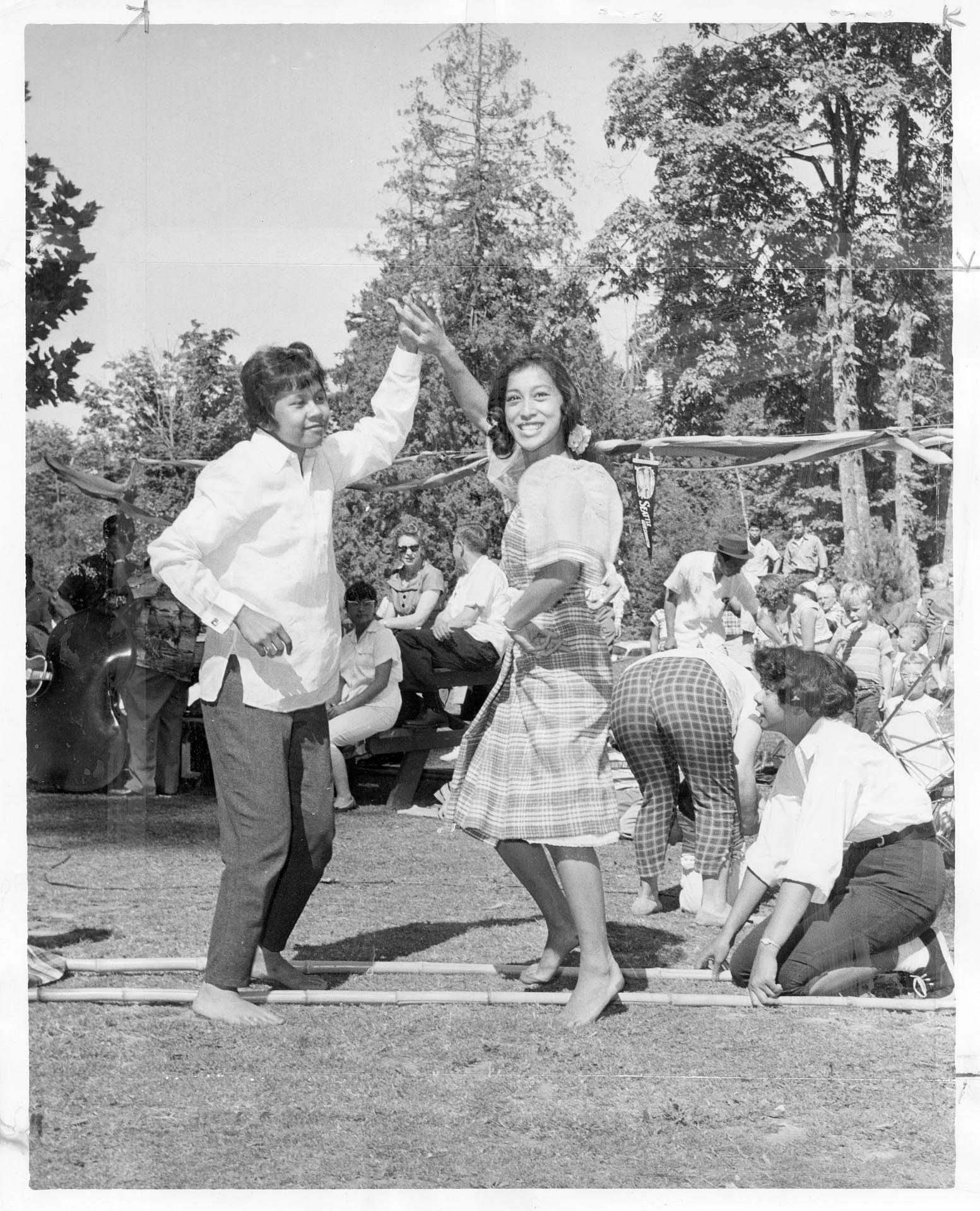 Image of Virginia Ordona, Diana Floresca, and Theresa Ordona dancing at Philippine Festival, Seattle, July 31, 1960