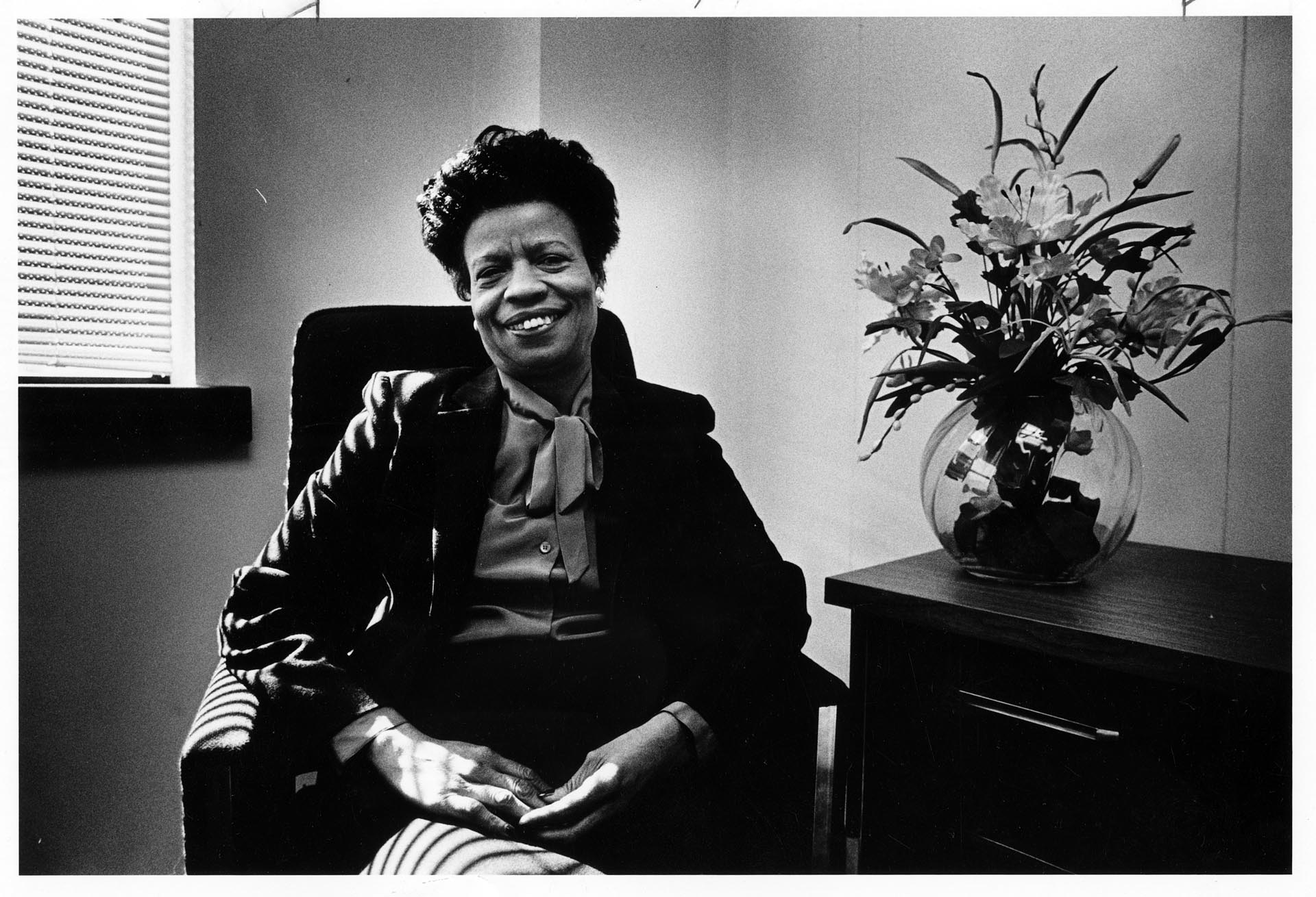 Image of Dorothy Hollingsworth sitting in her office, Seattle, March 1986