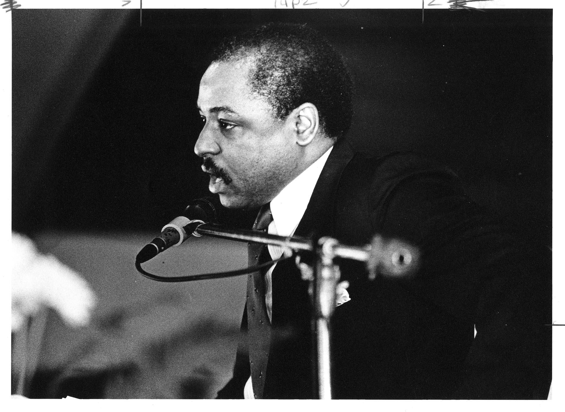 Image of Rev. Robert Jeffrey speaking during Eddie Bascomb's funeral at New Hope Missionary Baptist Church, February 24, 1987
