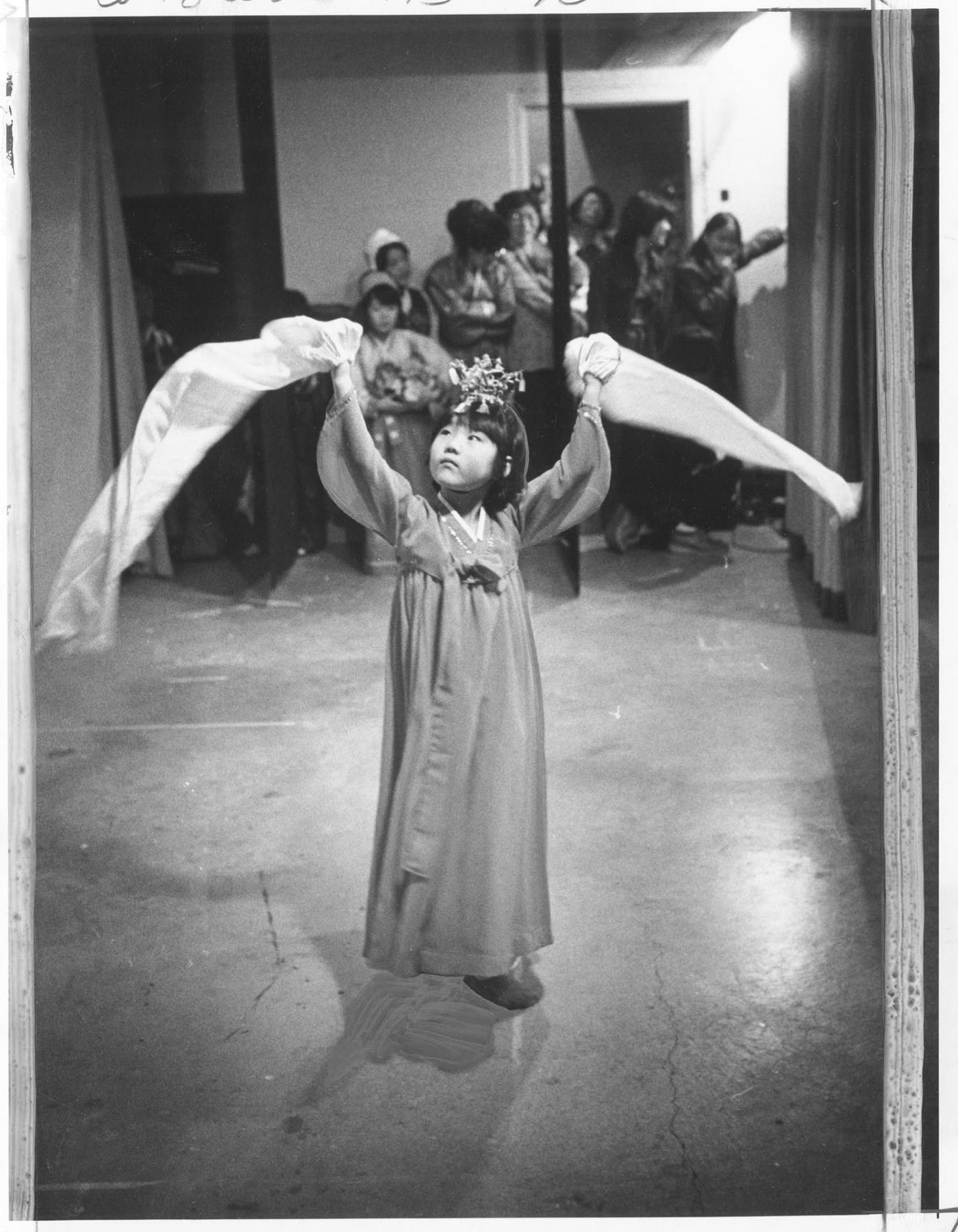 Image of Young girl performing Crown Dance at Sand Point Community Church, Seattle, January 23, 1977