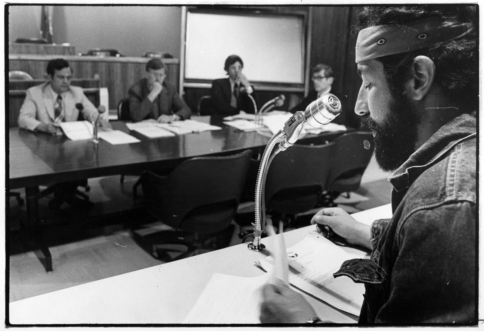 Image of Roberto Maestas speaking to city council members, Seattle, June 11, 1974