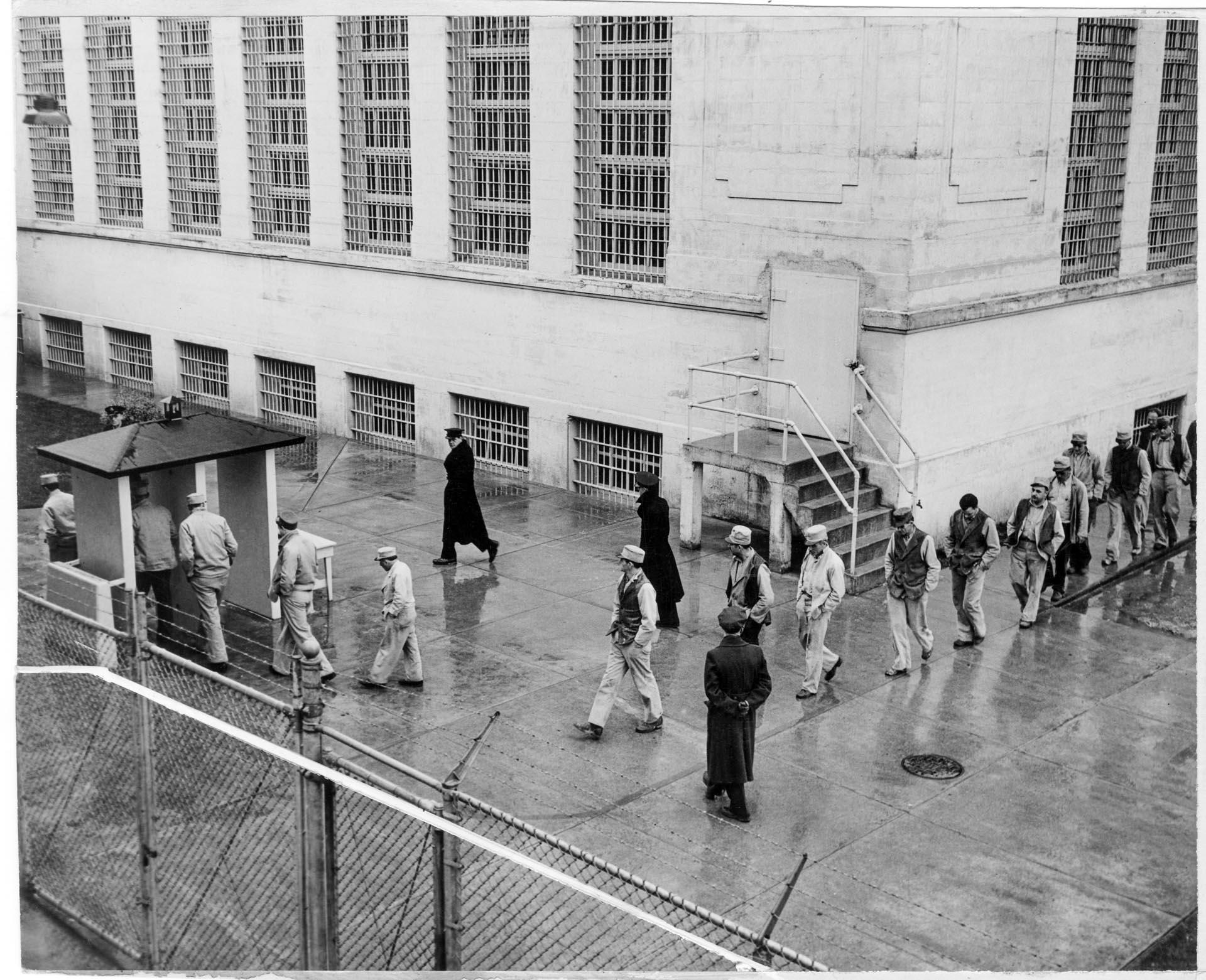 Image of Inmates retuning from work at McNeil Island Penitentiary, February 1939