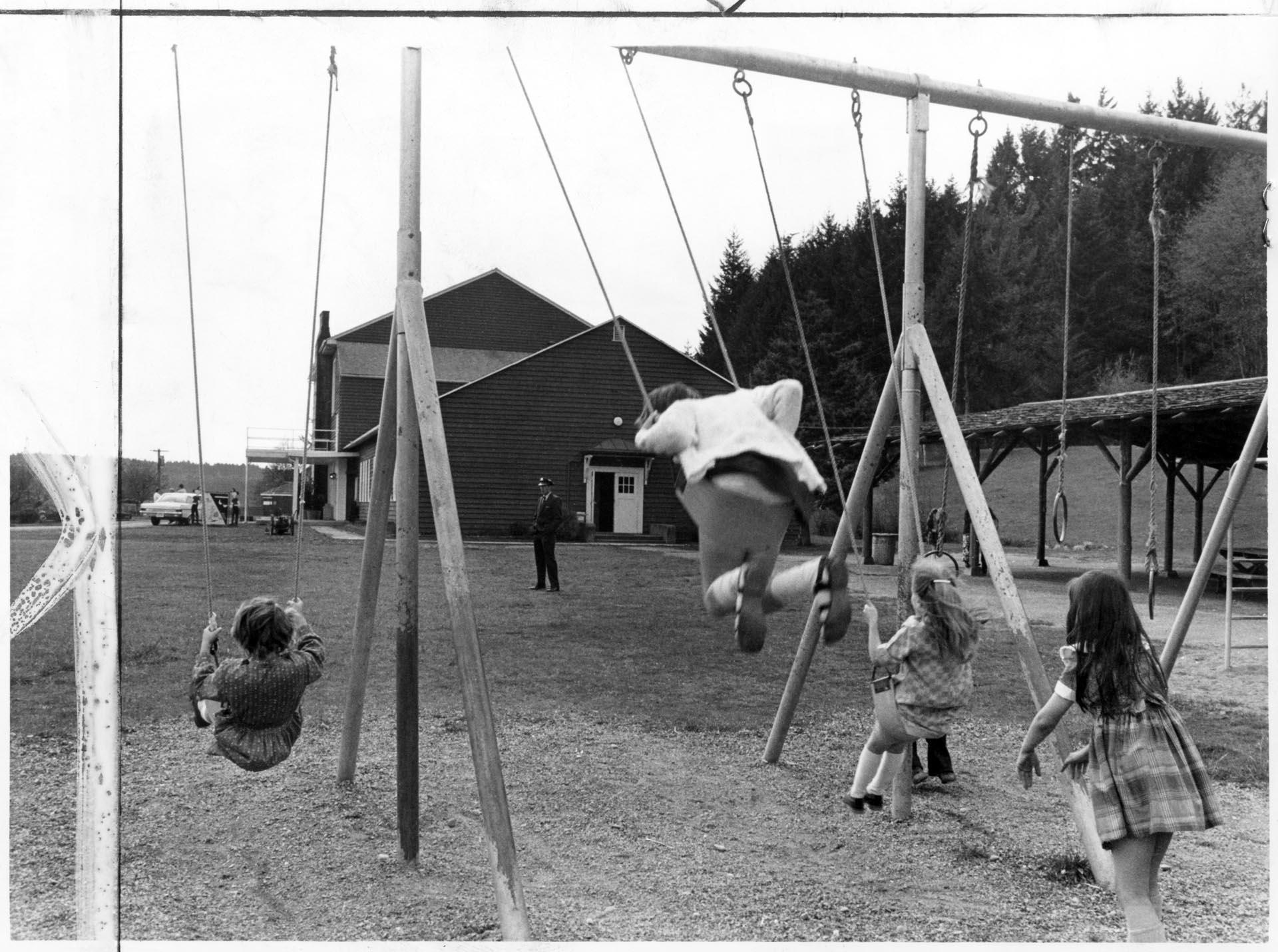 Image of Children on swings at McNeil Island playground, April 19, 1972