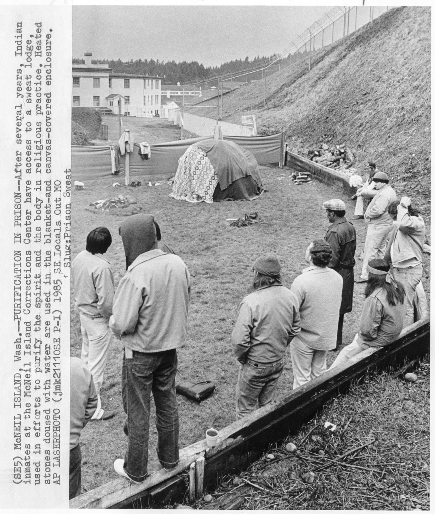 Image of Inmates watching a sweat lodge ceremony at McNeil Island Corrections Center, January 1985