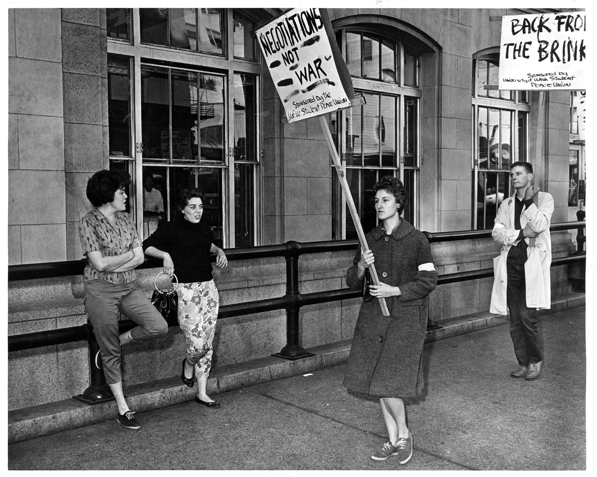 Image of Bystanders heckling UW Student Peace Union picketers, Seattle, October 23, 1962