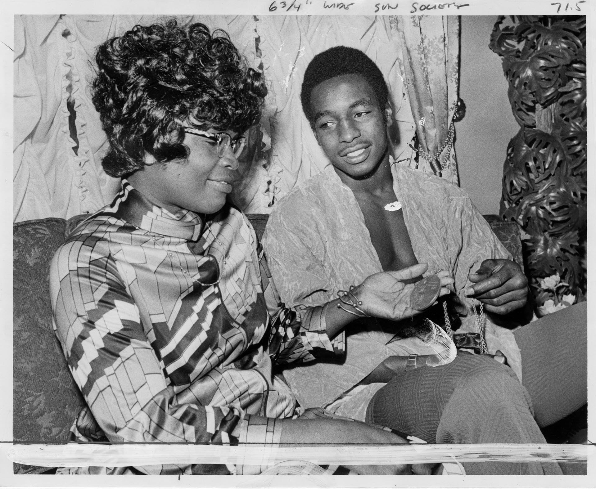 Image of Ray Seales and his mother with his Olympic gold medal, circa 1973