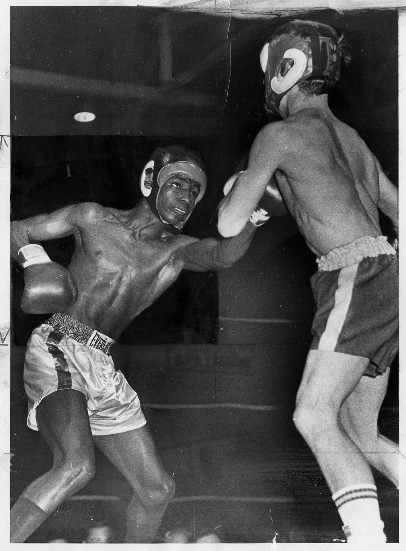 Image of Ray Seales and Ray Haley boxing at Tacoma Golden Gloves prelinimaries, January 1970