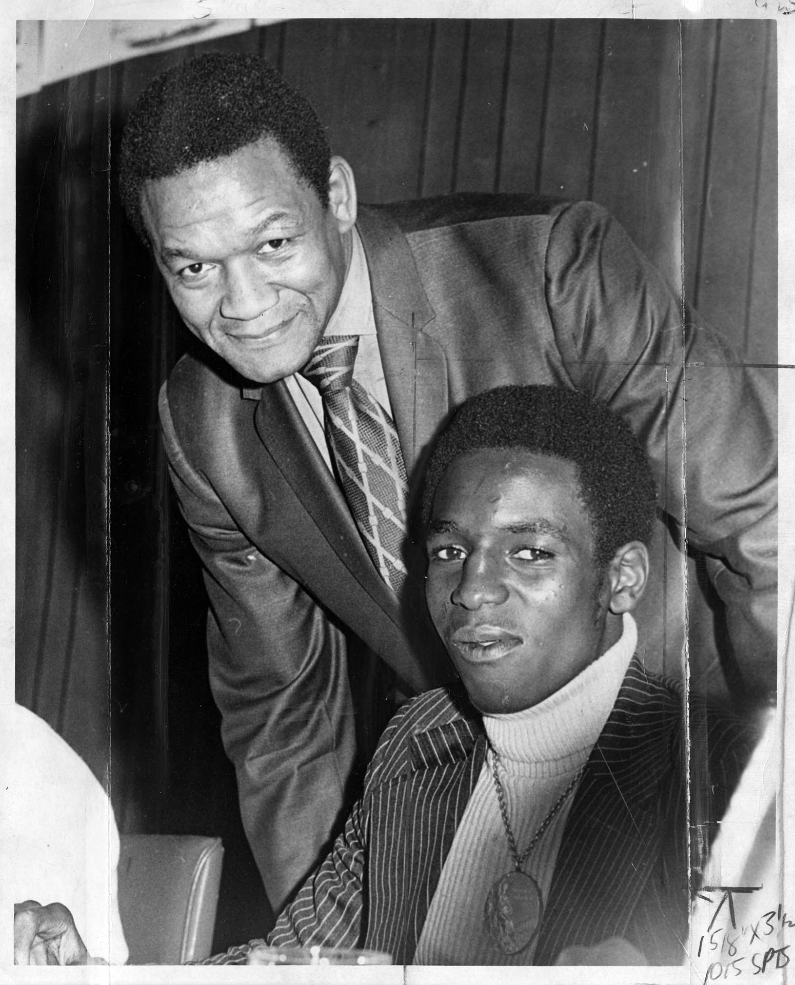 Image of Ray Seales and Eddie Cotton at annual PI sports banquet, January 9, 1973