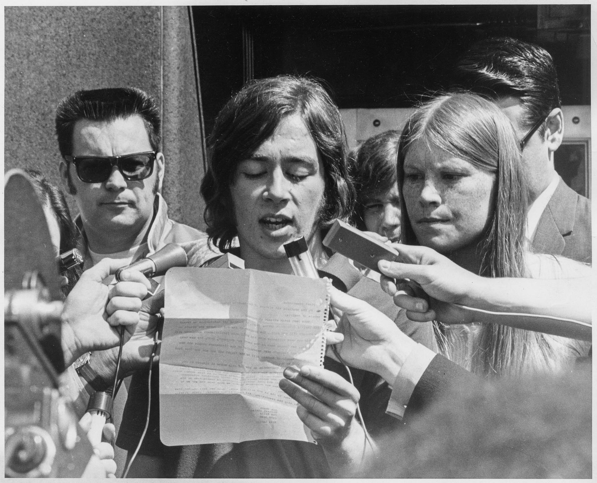 Image of Jeff Bickford reading SLF statement after arrests, April 17, 1970