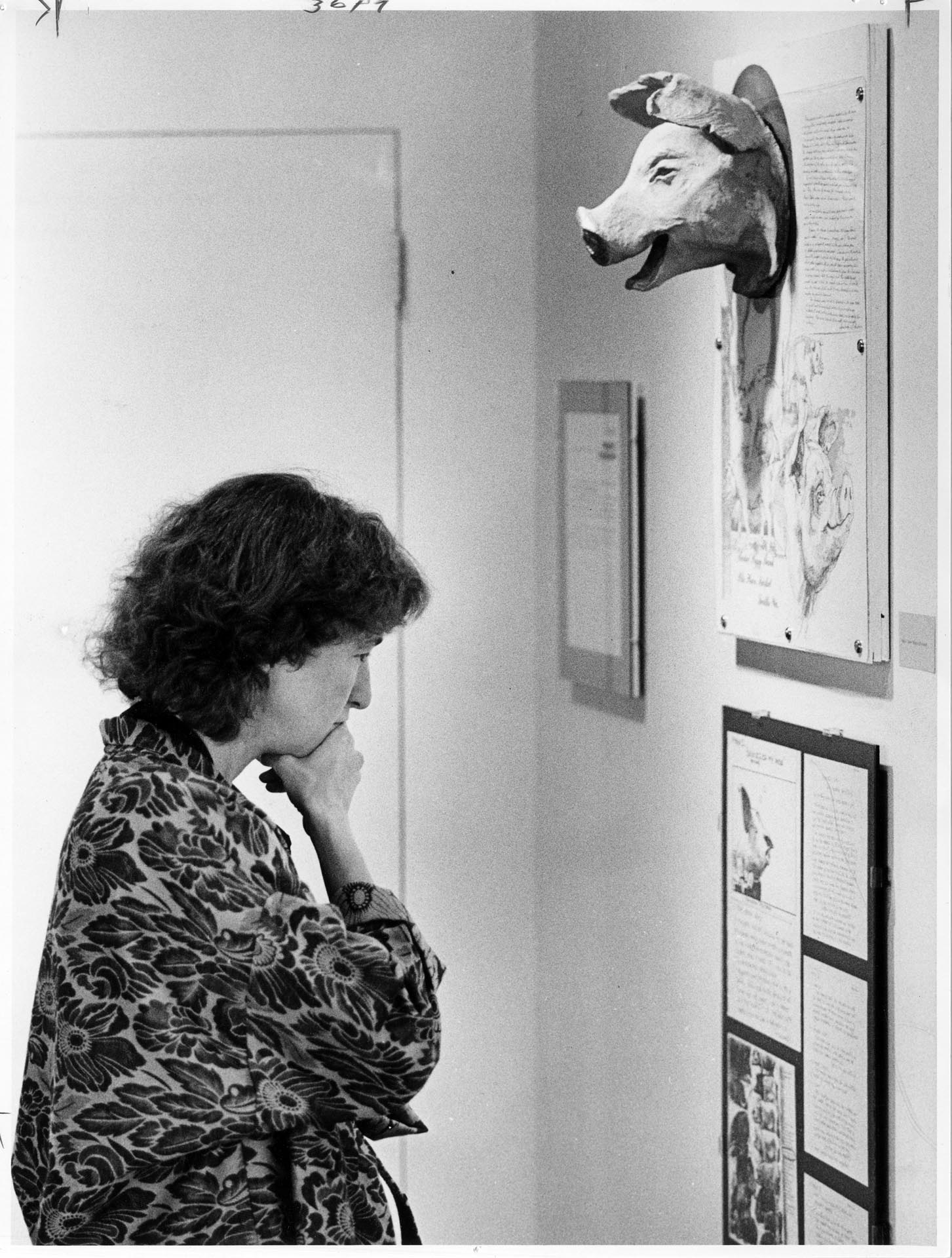 Image of Anne Focke reviewing Pike Place Market piggy bank designs, Seattle, August 28, 1986