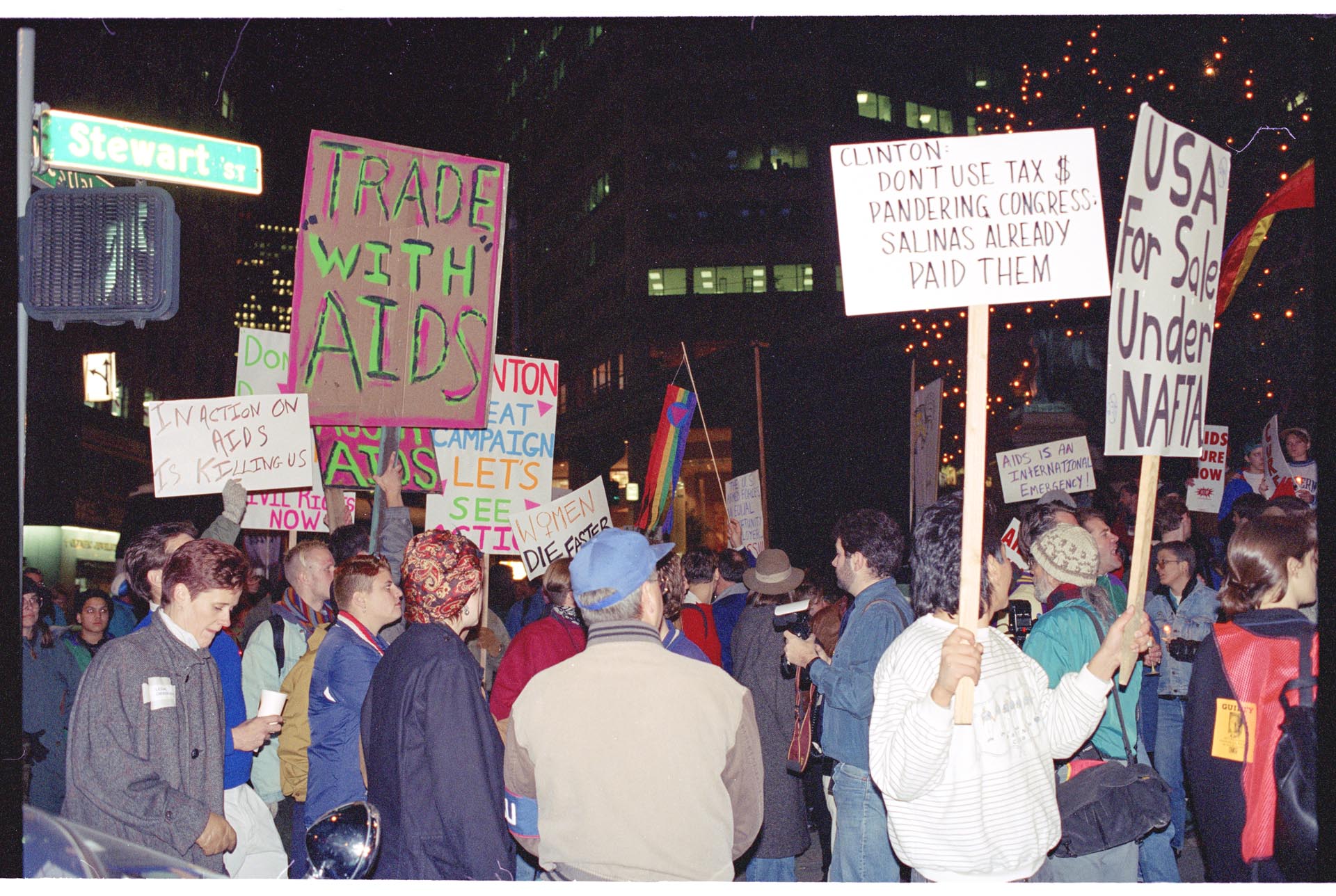 Image of Demonstrators with signs outside Westin Hotel  prior to APEC conference, Seattle, November 19, 1993