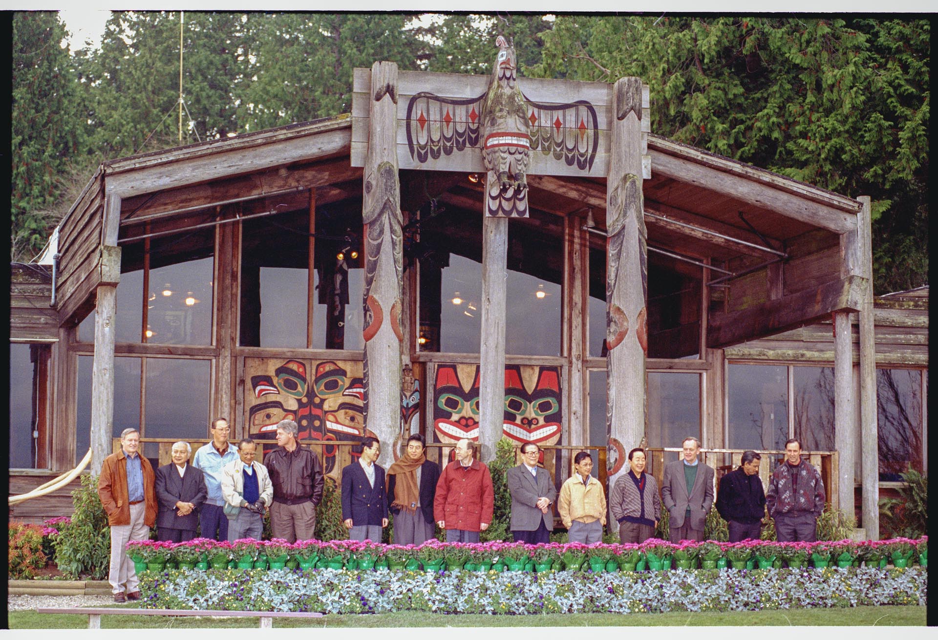 Image of APEC conference attendees posing together at Tillicum Village, Blake Island, November 20, 1993