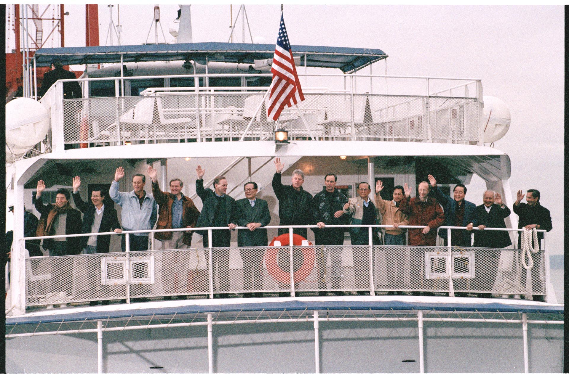 APEC conference attendees waving from boat at Tillicum Village, Blake  Island, November 20, 1992 – Museum of History & Industry