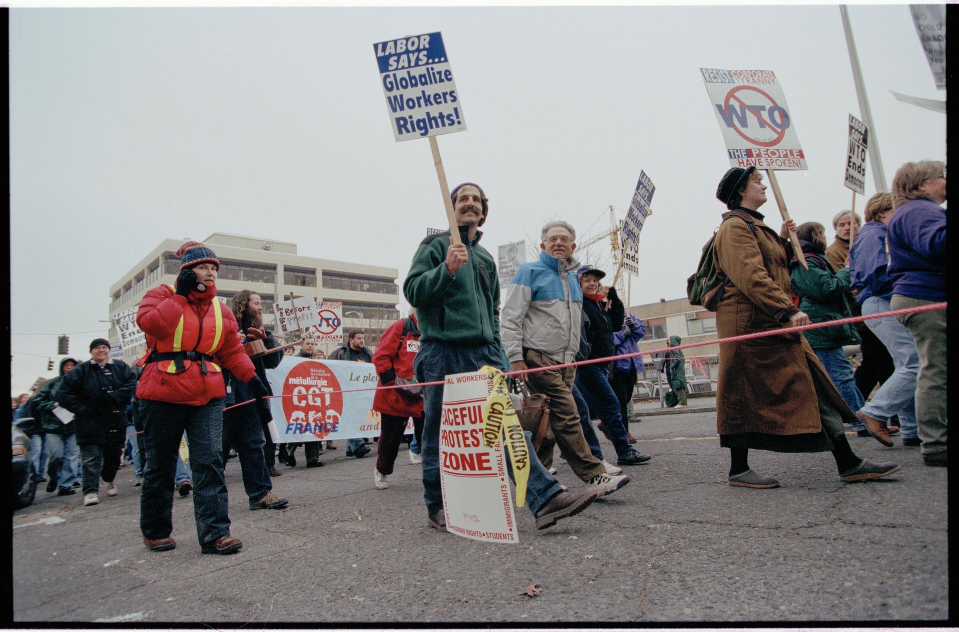 Image of Demonstrators marching at WTO protest, Seattle, December 3, 1999