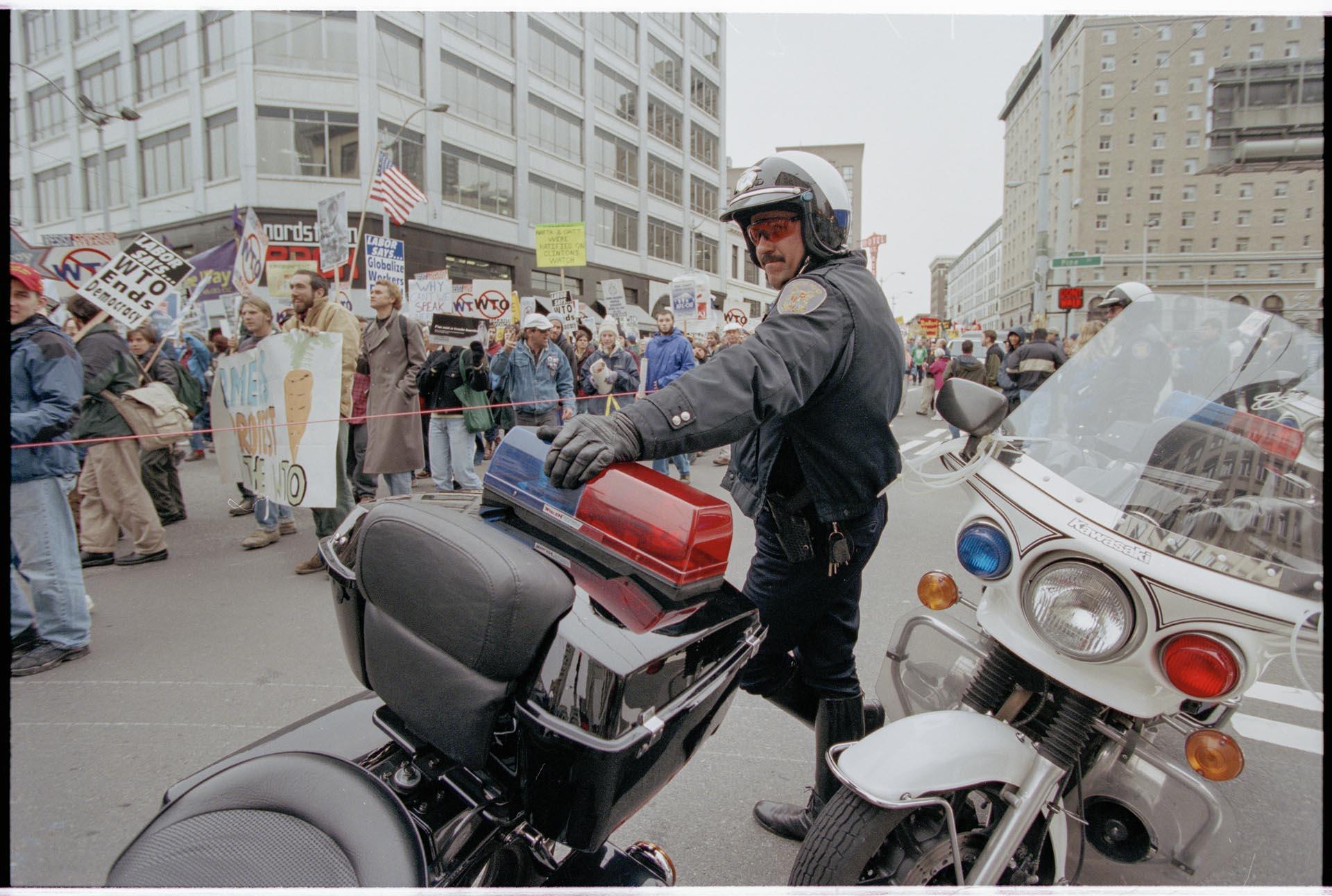 Image of Motorcycle police officer at WTO march, Seattle, December 3, 1999