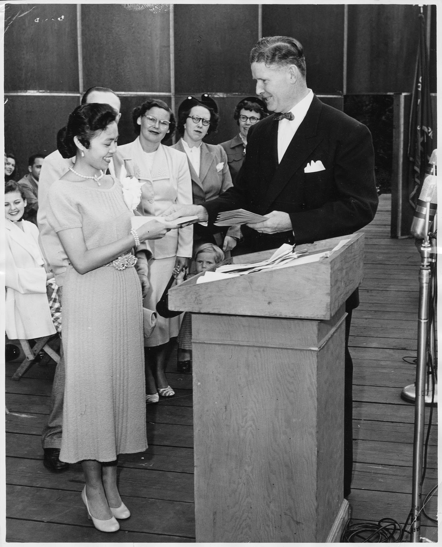 Image of Nina Rivera receiving U.S. naturalization papers, Seattle, July 2, 1952