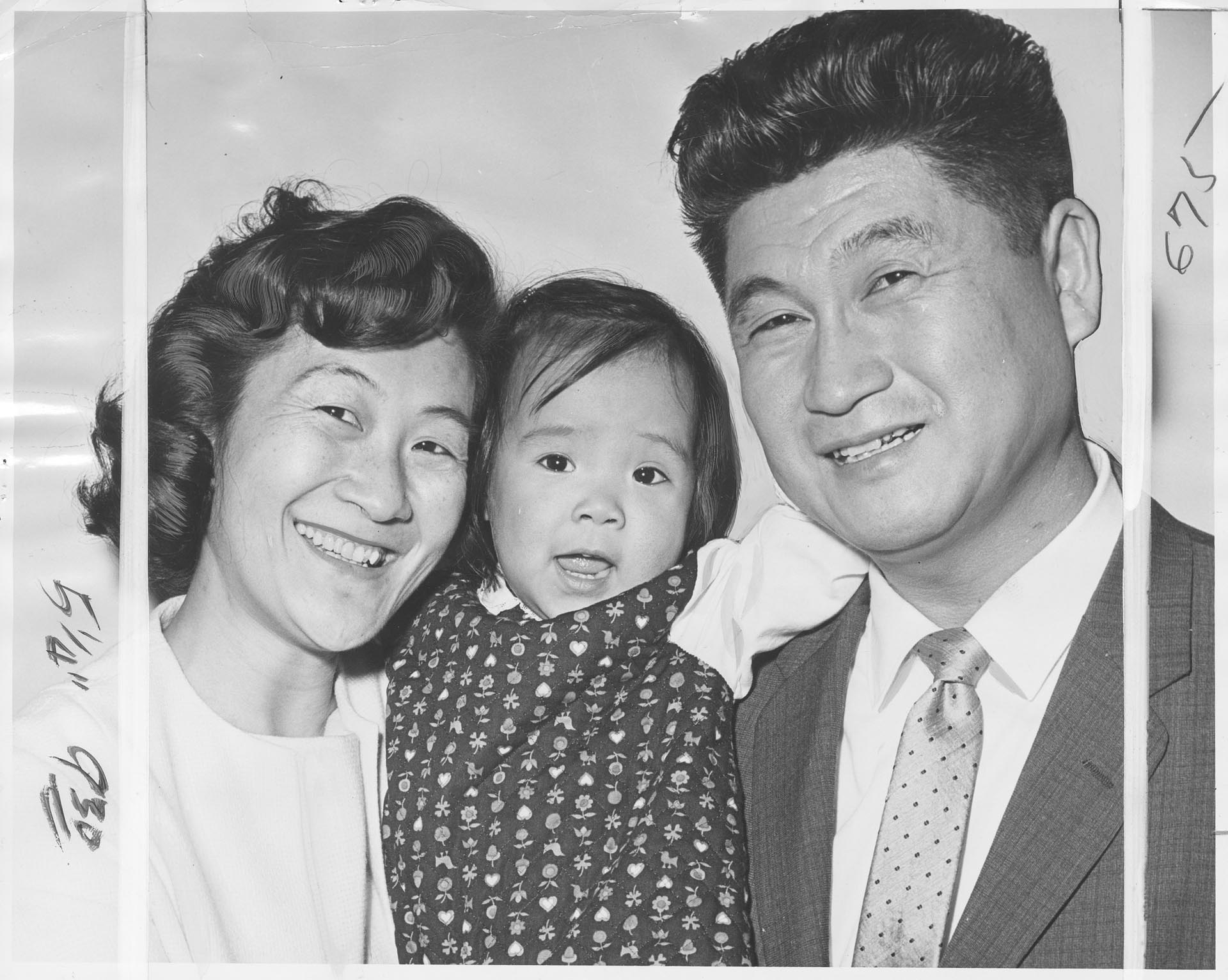 Image of Tamura family posing at U.S. naturalization ceremony, Seattle, November 1, 1965