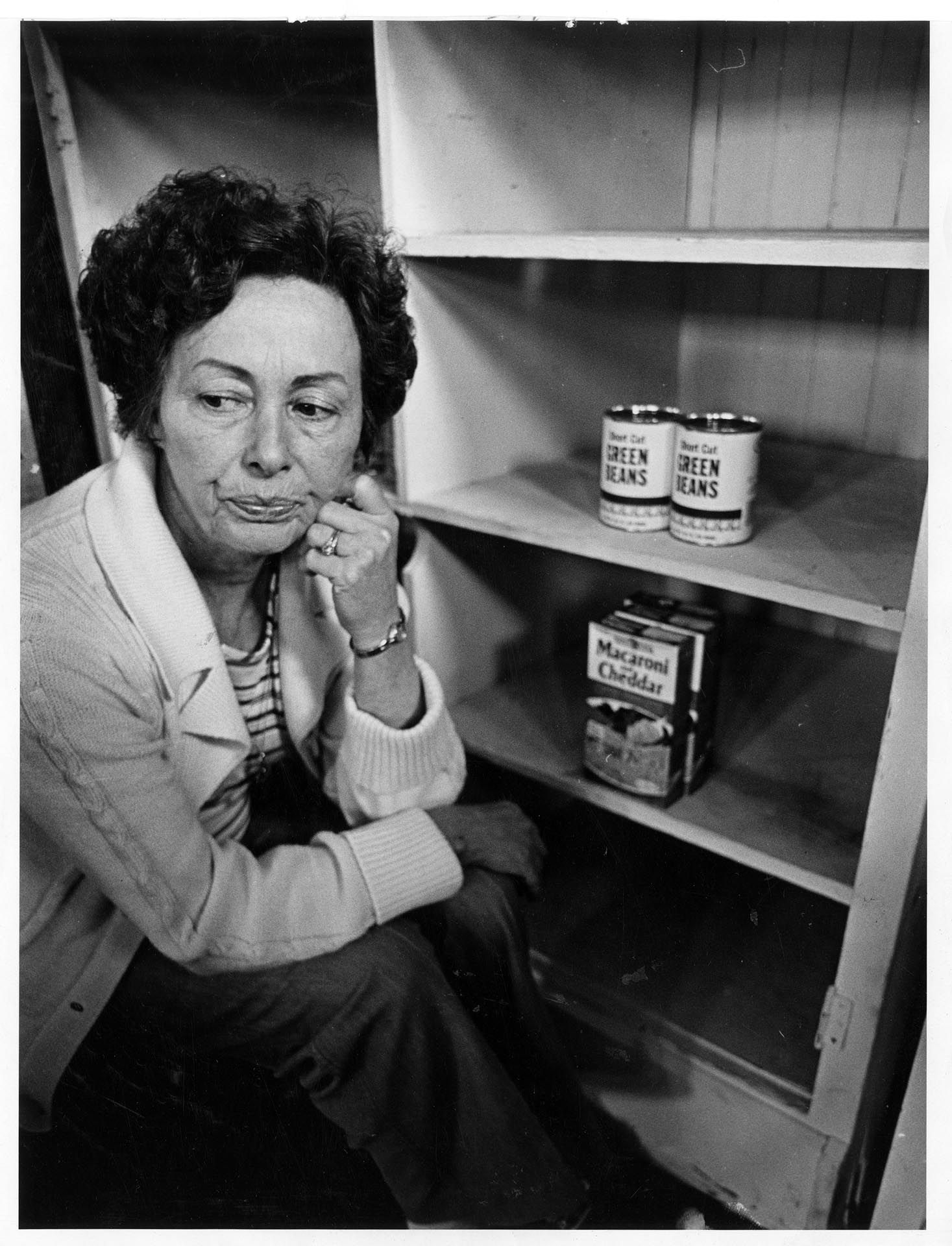 Image of Ruth Velozo worrying over empty shelves at Northwest Harvest, Seattle, April 6, 1981