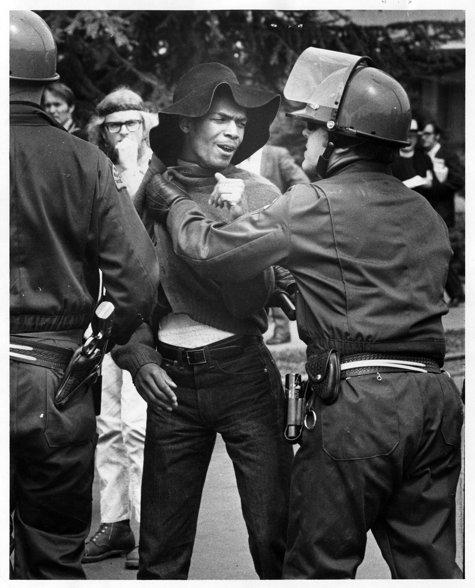 Image of Emile Wilson and police officer at Seattle University protest, May 21, 1970