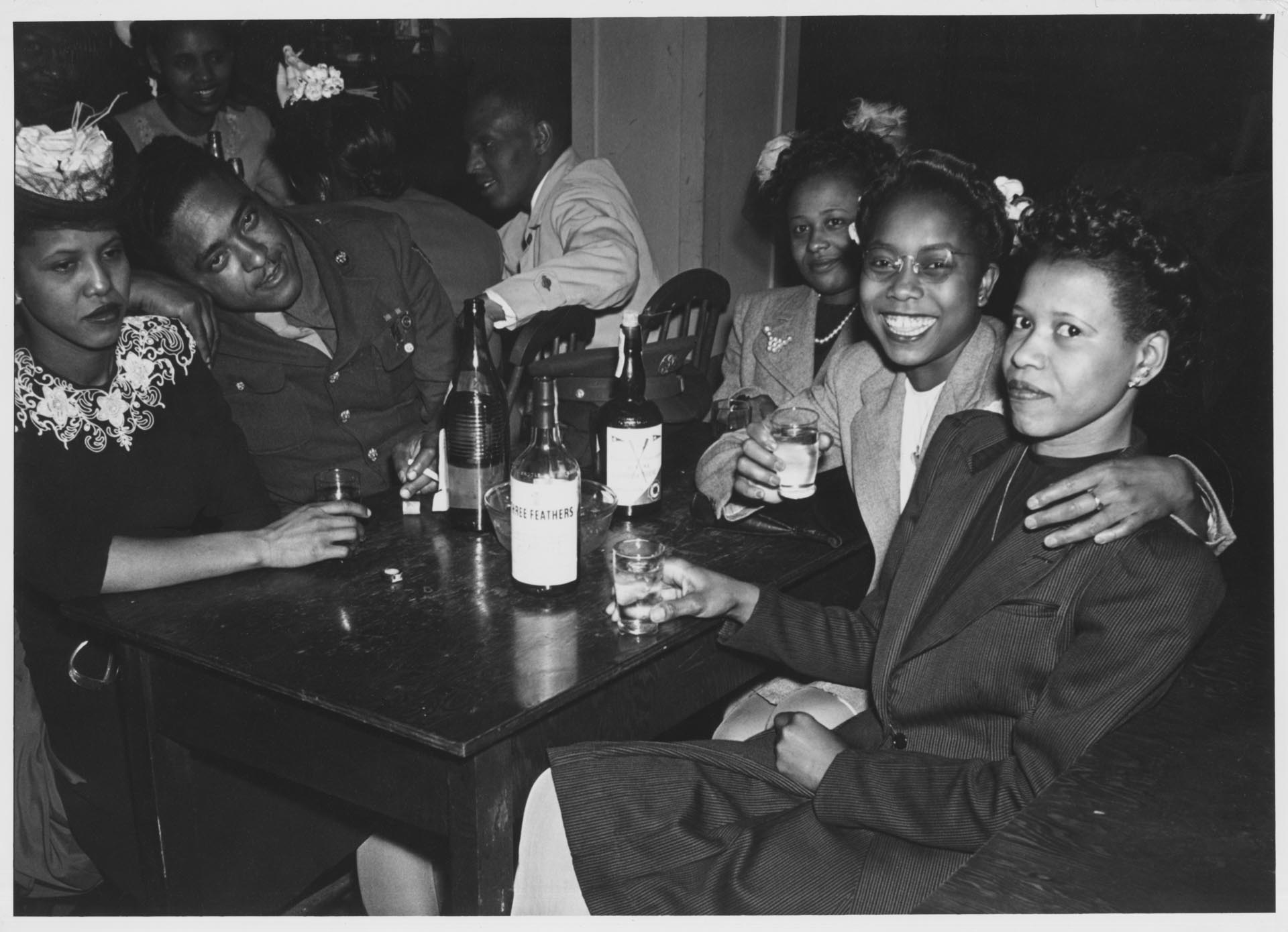 Image of Group of Basin Street nightclub patrons around a table, Seattle, May 1944