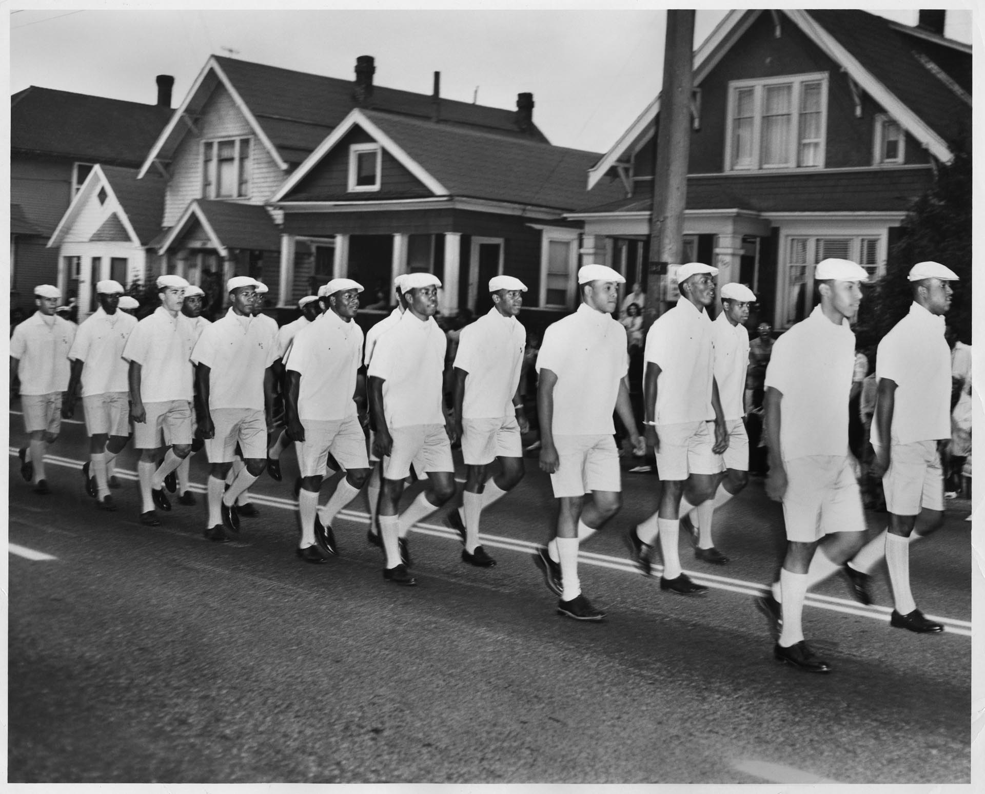 Image of Men marching in a Mardi Gras parade, Seattle, circa 1956