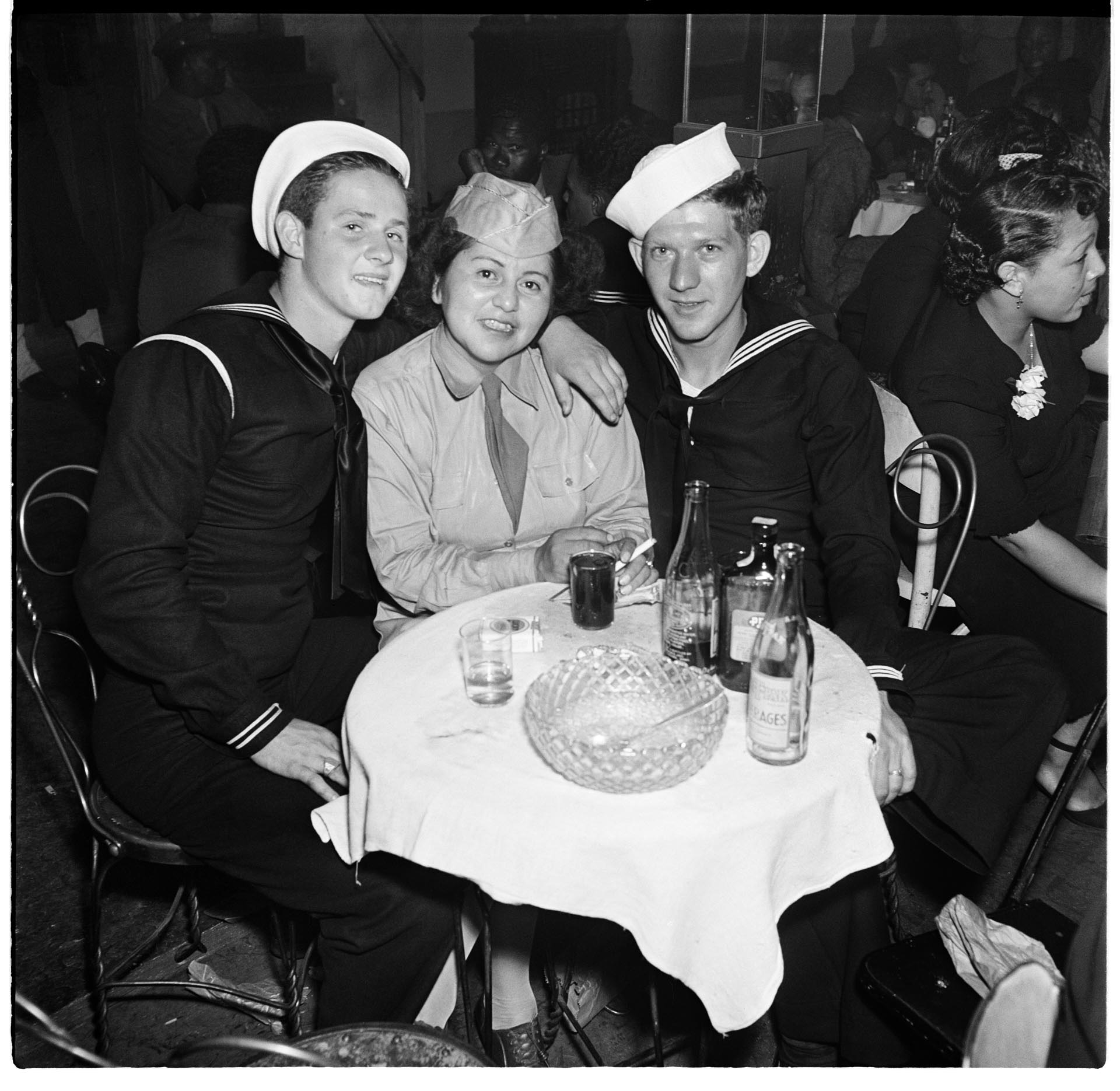 Image of Private Lois Jones and two friends at a jazz club, Seattle, circa 1944