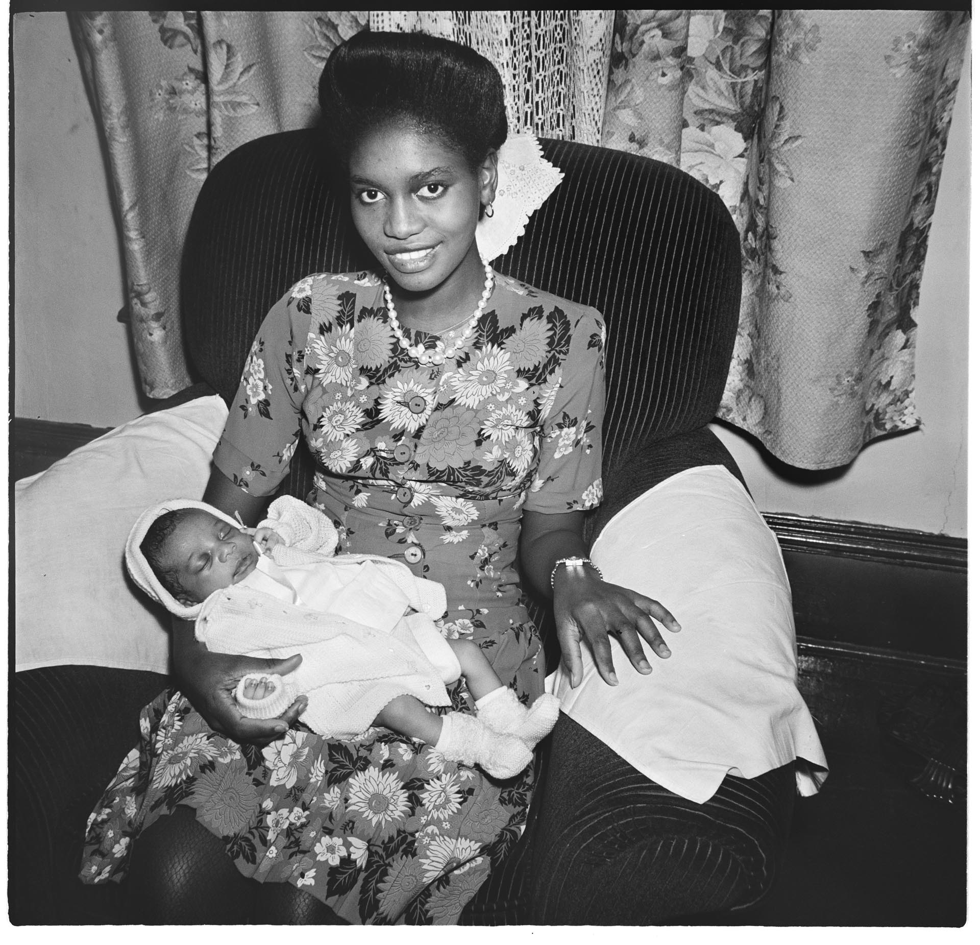 Image of Woman with a young baby, Seattle, 1945