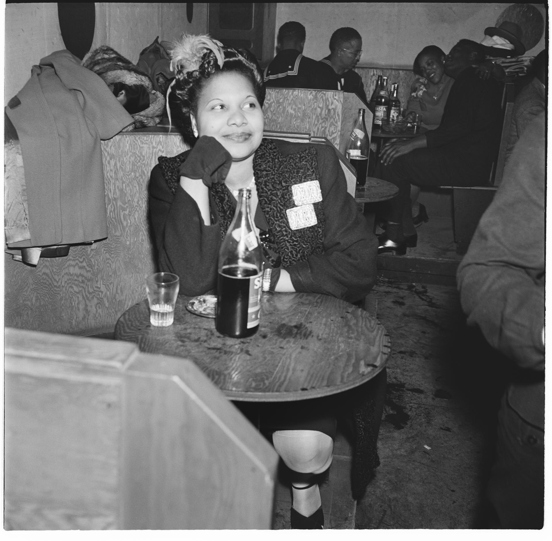 Image of Woman sitting at table at the Basin Street nightclub, Seattle, September 1945