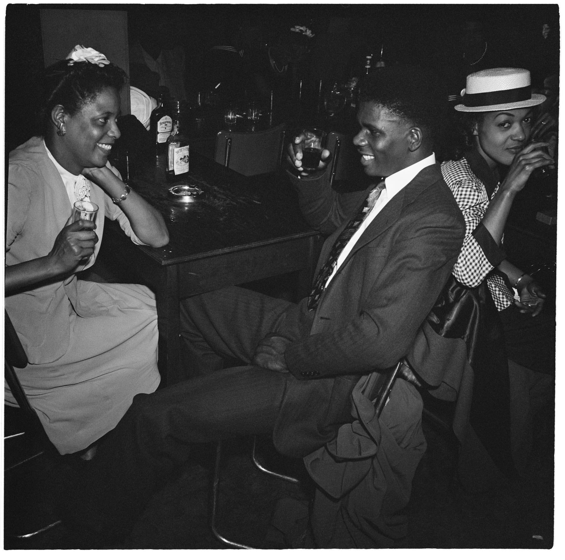 Image of Three people at the bar at the Basin Street nightclub, Seattle, August 18, 1945