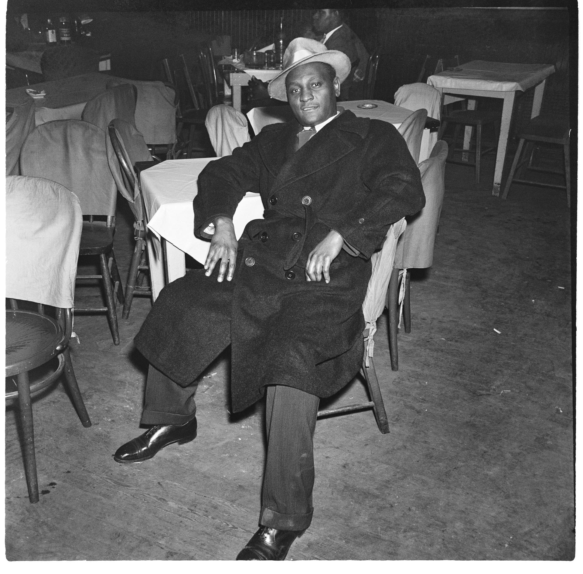 Image of Man seated at table at the Black and Tan nightclub, Seattle, February 1945