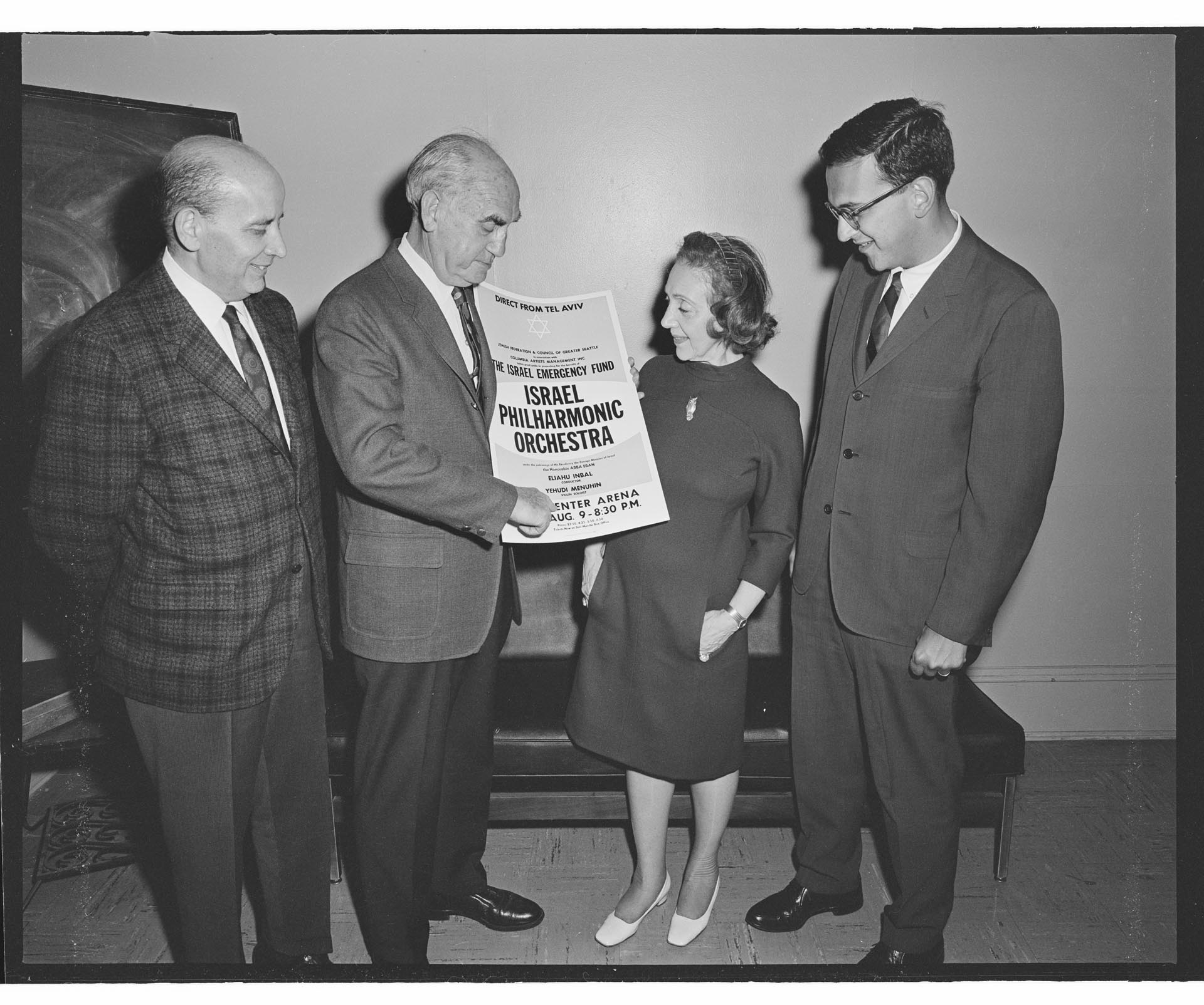 Image of Four people with poster for Israel Emergency Fund benefit concert, Seattle, August 1967