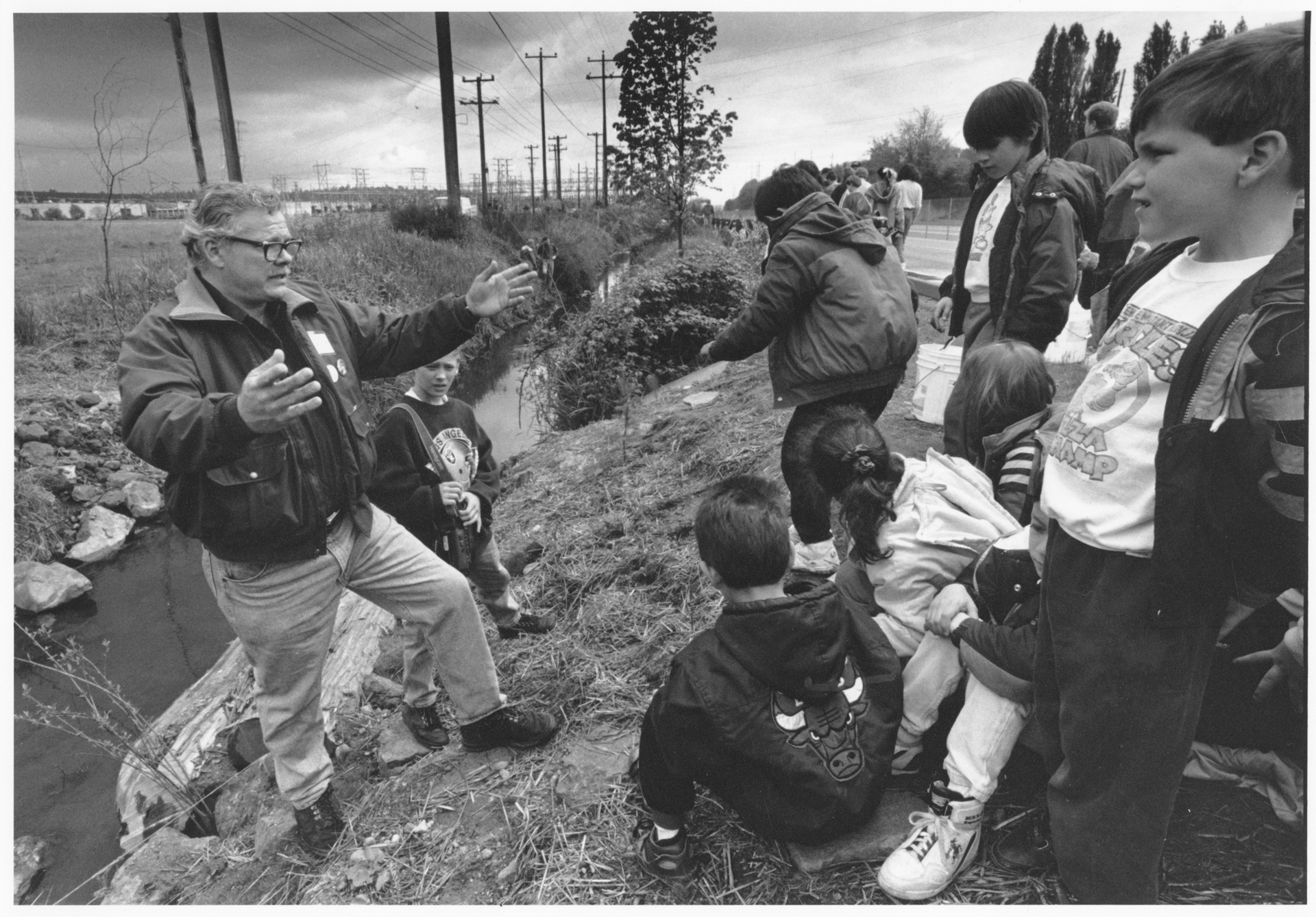 Image of John Beal with children from Concord School at Hamm Creek, Seattle, April 30, 1993