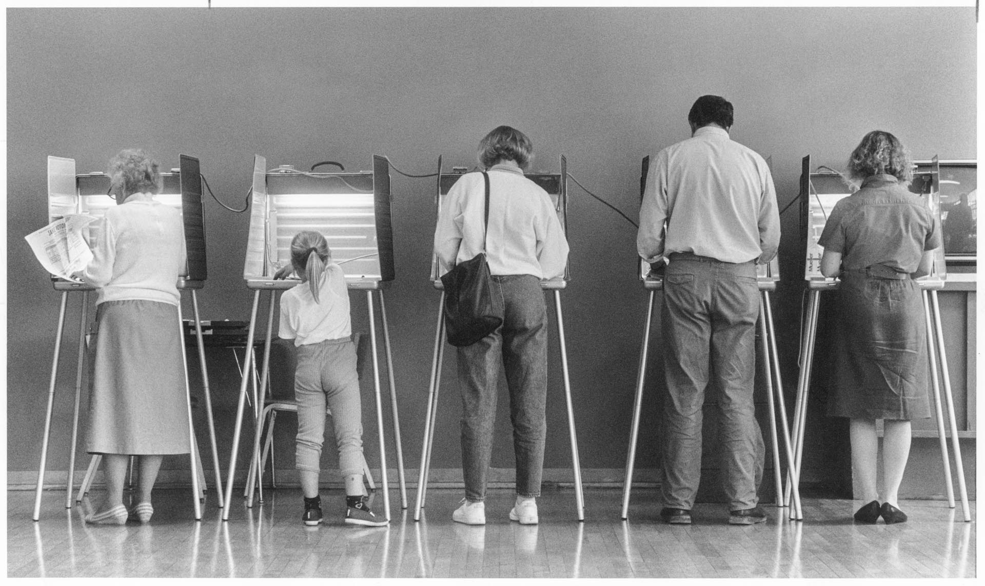 Image of Lucette Lightfoot and her daughter at voting booth, Seattle, September 20, 1988