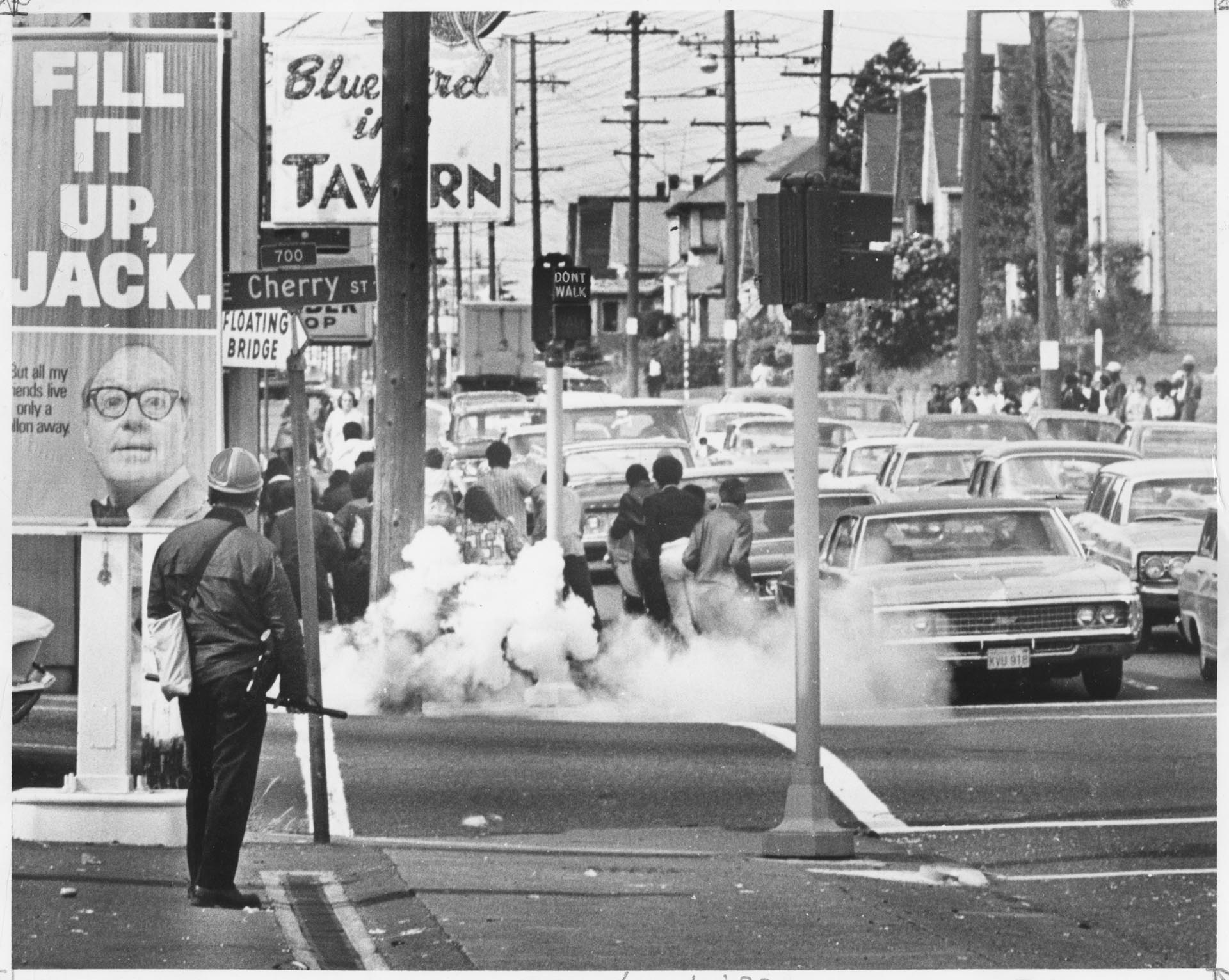 Image of Protesters running from tear gas at 23rd and Cherry, Seattle, May 26, 1969
