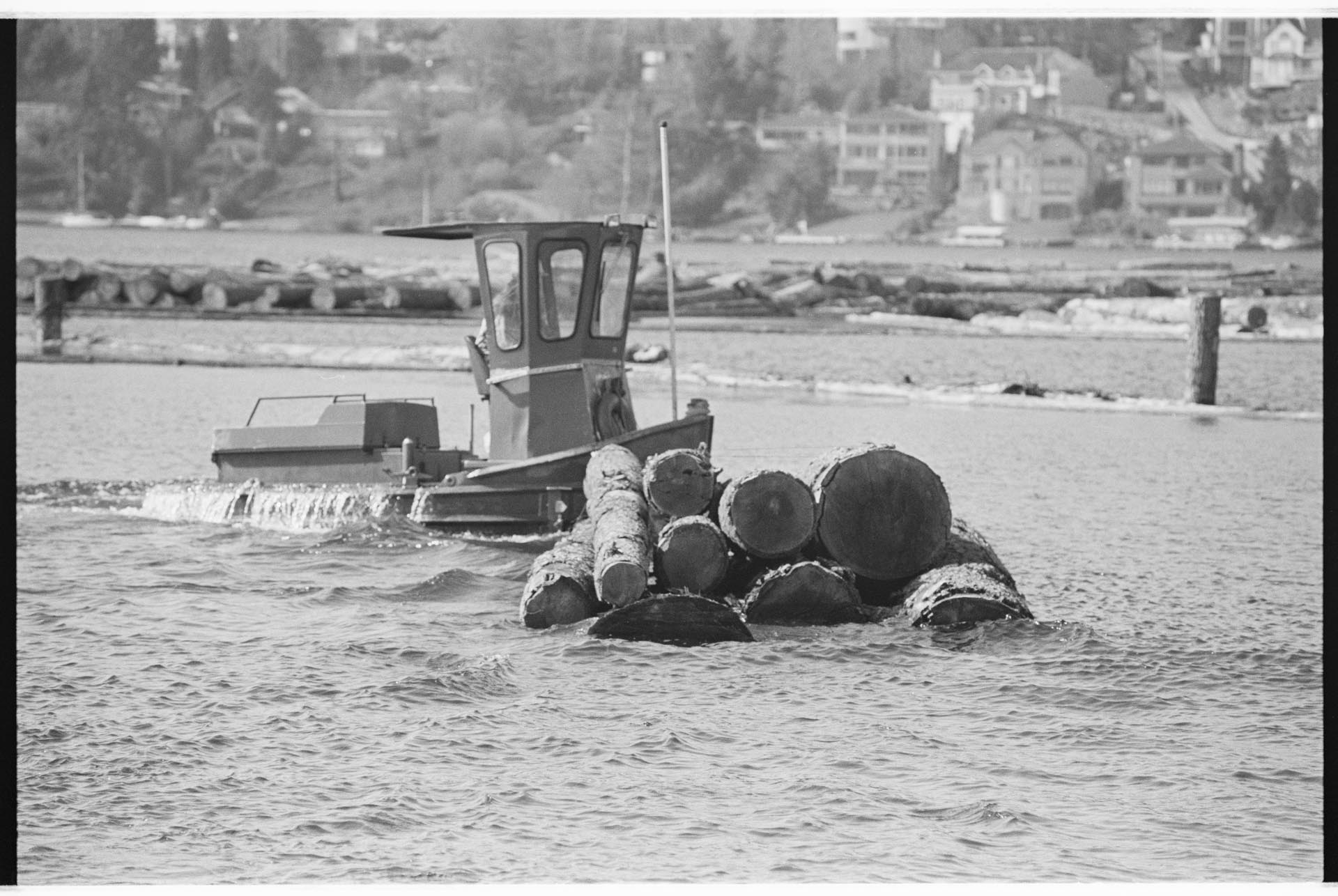 Image of Employee working in Barbee Mill Co. log pond, Renton, March 9, 1993