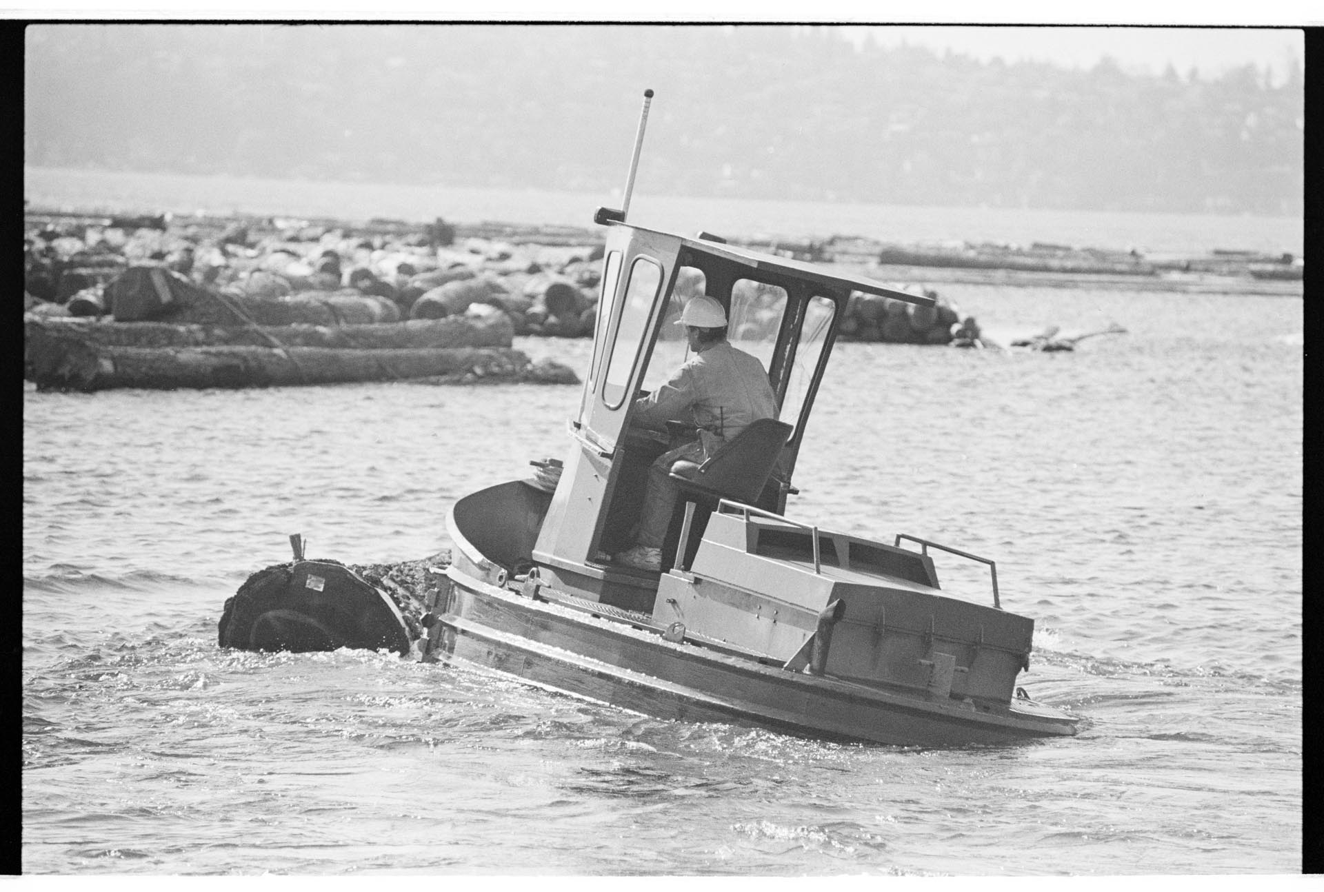 Image of Employee working in Barbee Mill Co. log pond, Renton, March 9, 1993