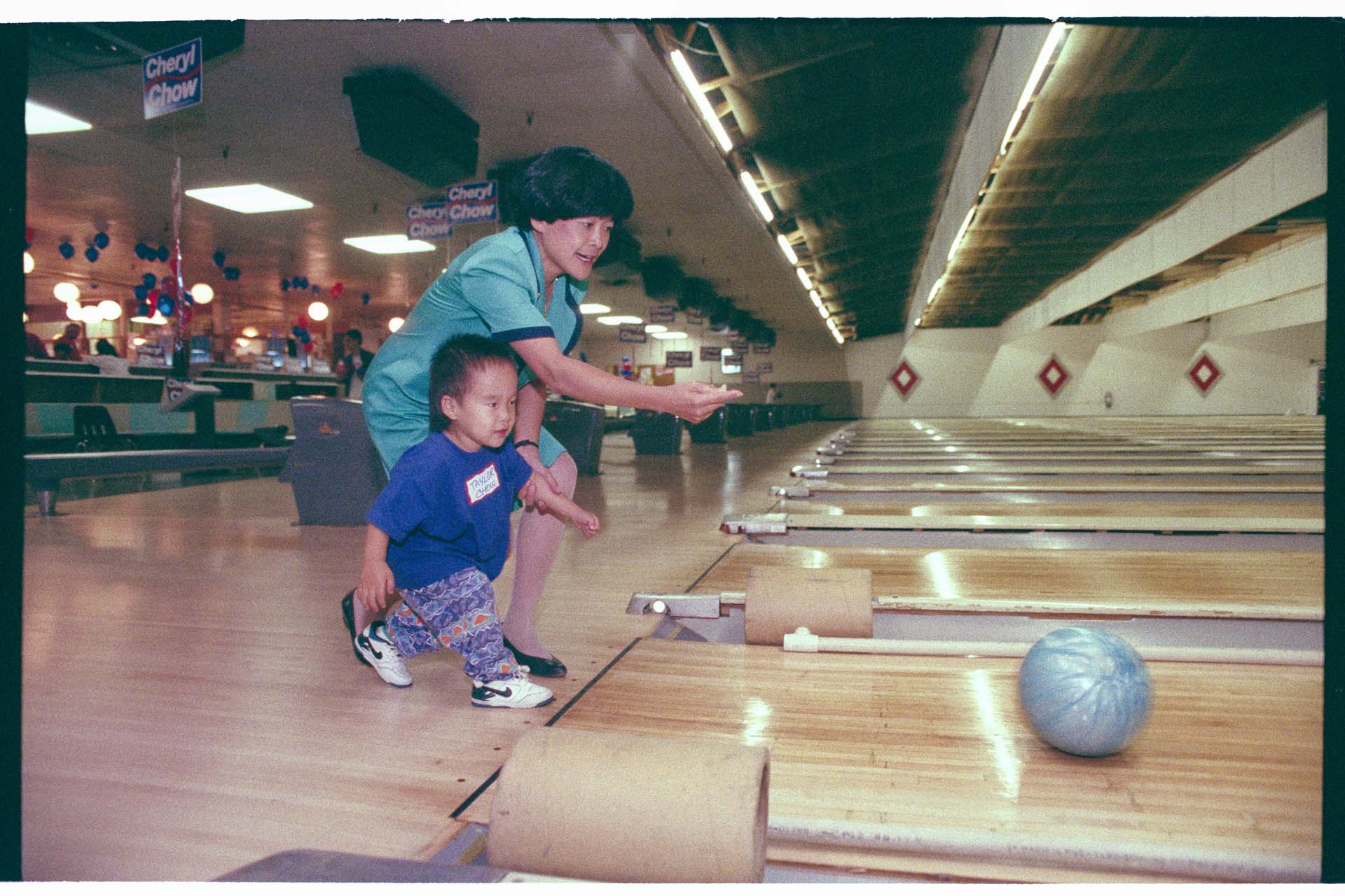 Image of Cheryl Chow bowling at campaign event, May 1993