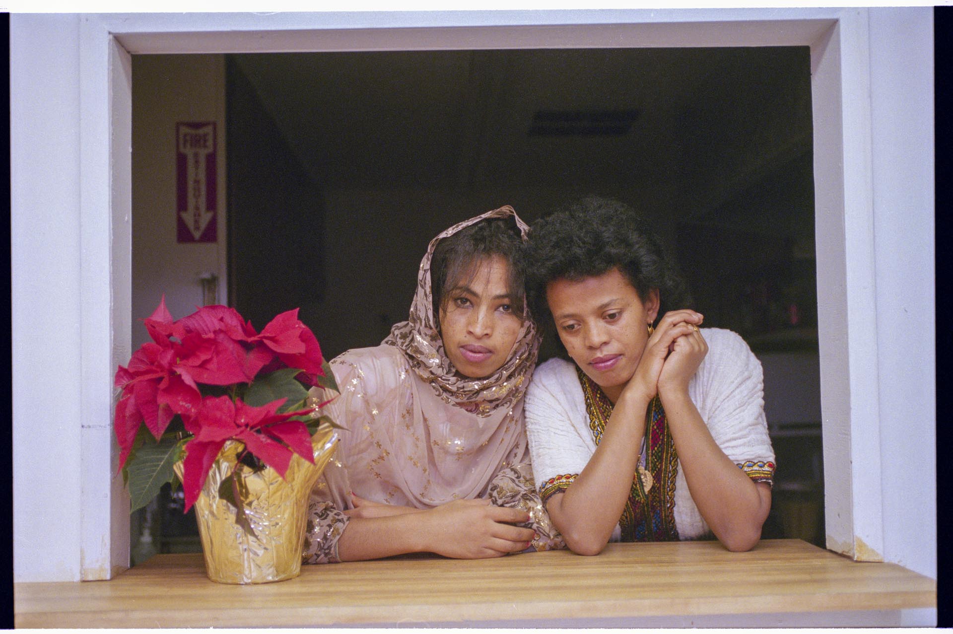 Image of Two women in traditional dress for Kwanzaa celebration, December 29, 1995